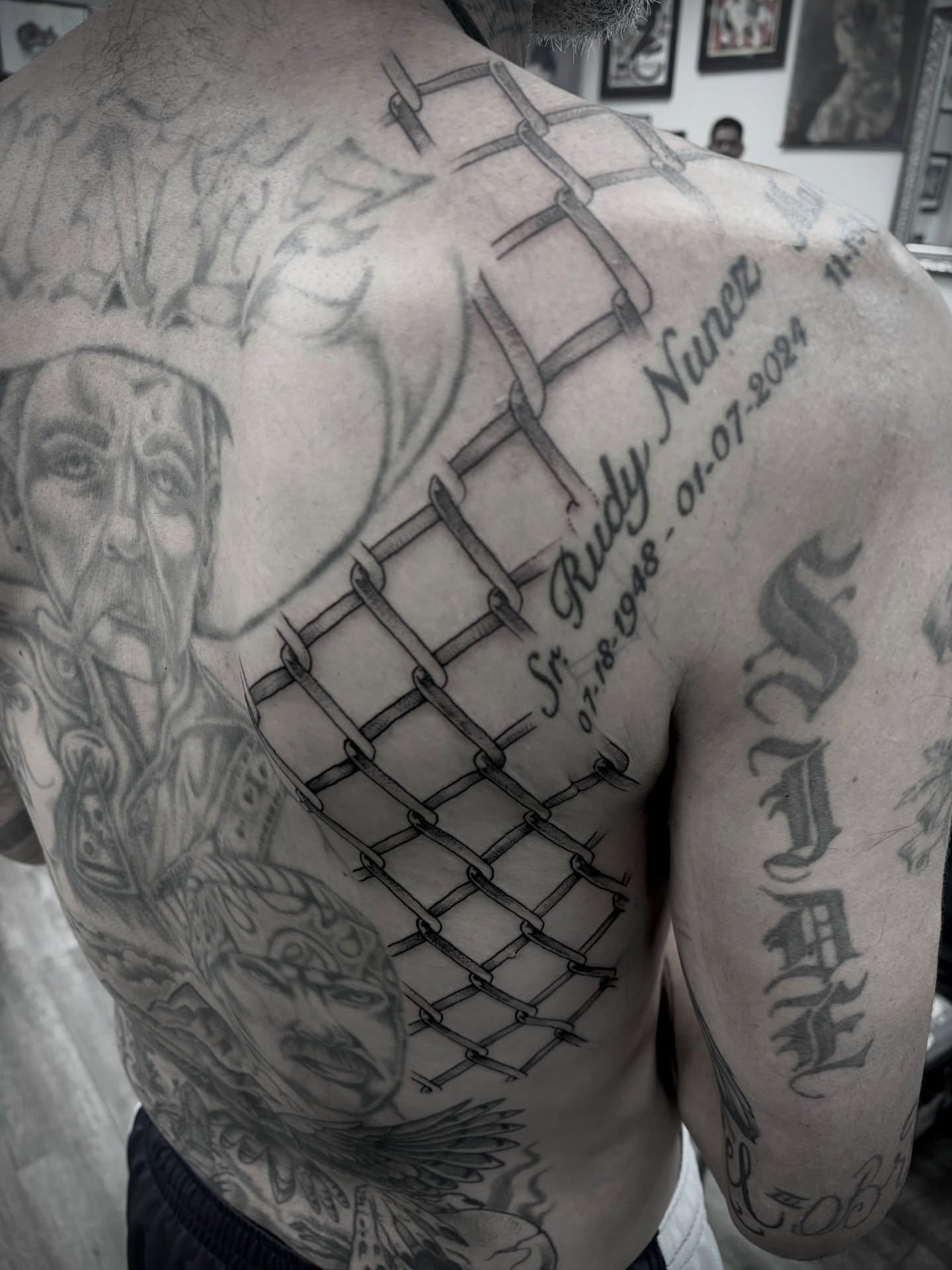 Prison bars black and grey tattoo on the back by Jason Allen, Avondale, Arizona