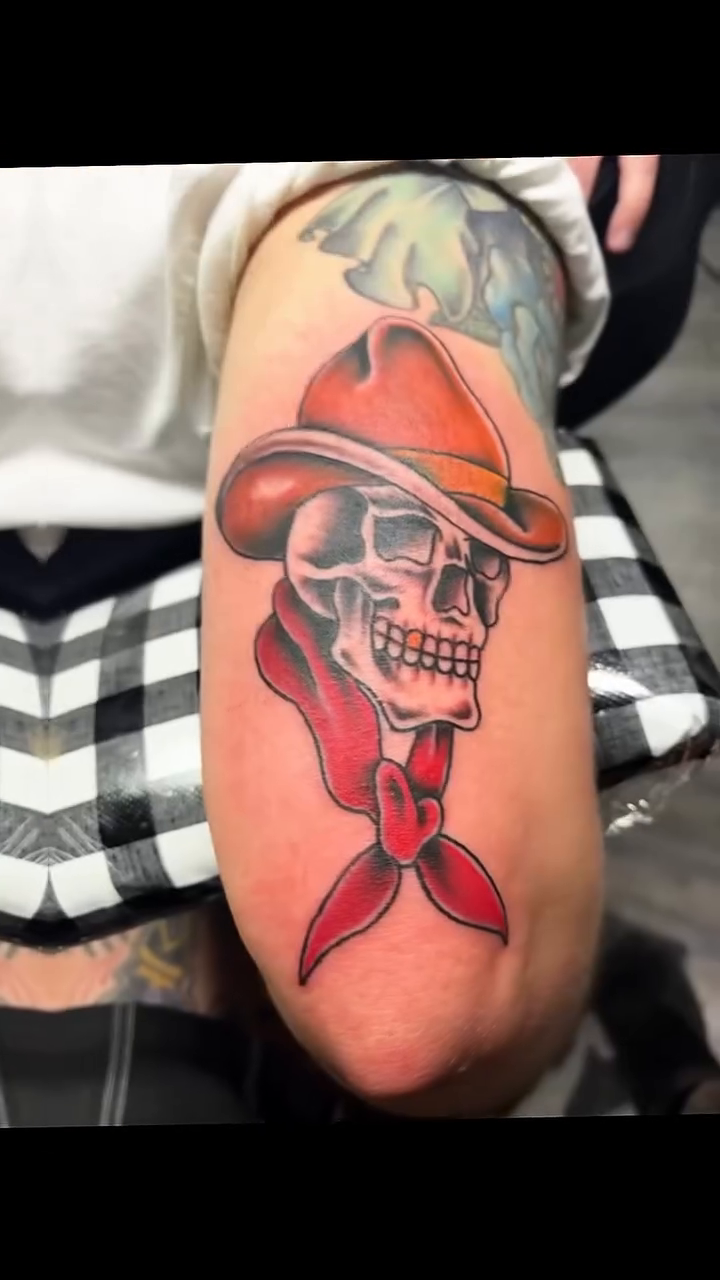 Cowboy skull with bandana American traditional tattoo on the upper arm by ⚓️Jake