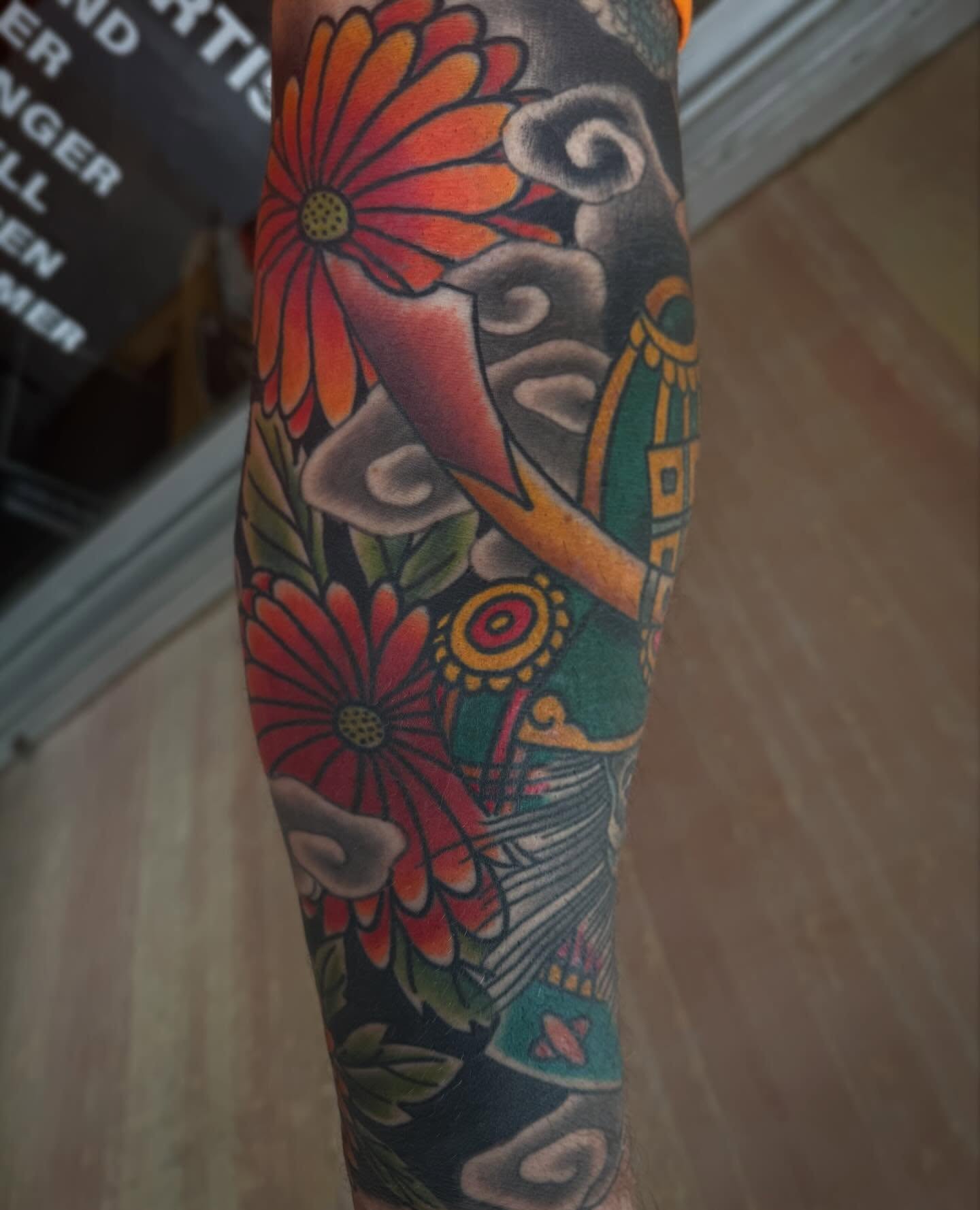 Floral arrangement American traditional tattoo on the forearm by Mike Diamond