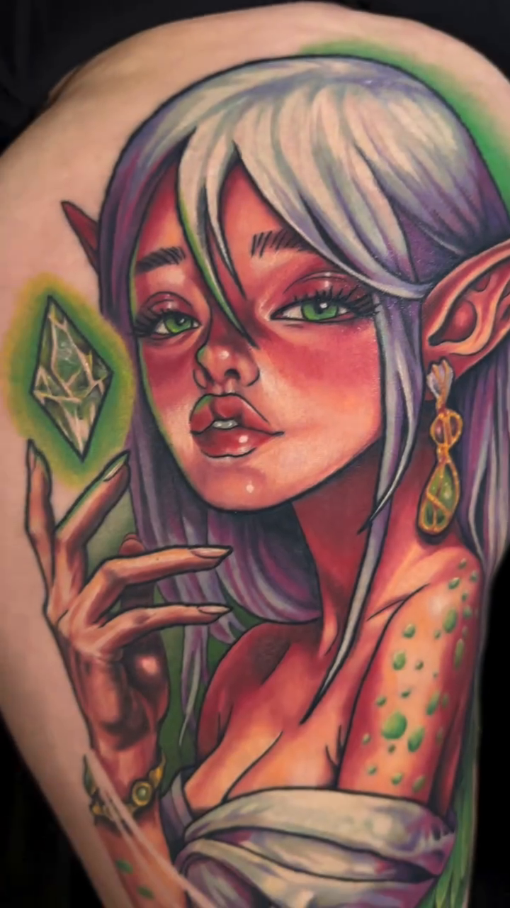 Elf woman with butterflies surrealism tattoo on the upper arm by Kim Goff - Special K