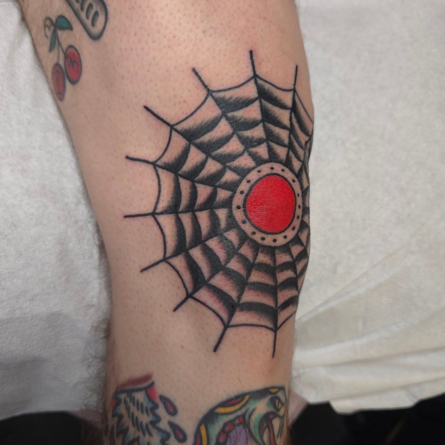 Spider web American traditional tattoo on the forearm by Jared Green