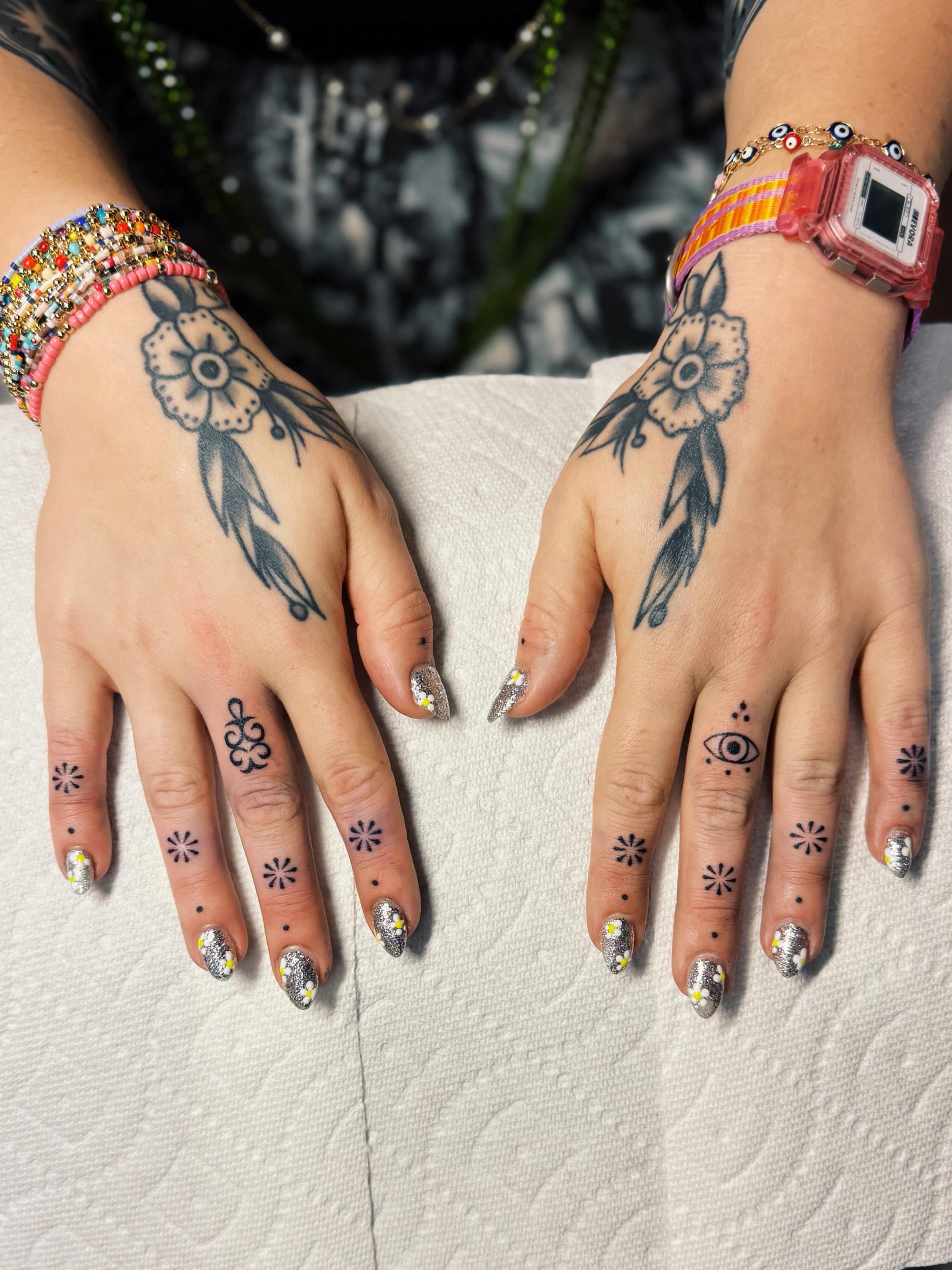 Floral dreamcatcher dotwork tattoo on the hand by @amandahowtattoo