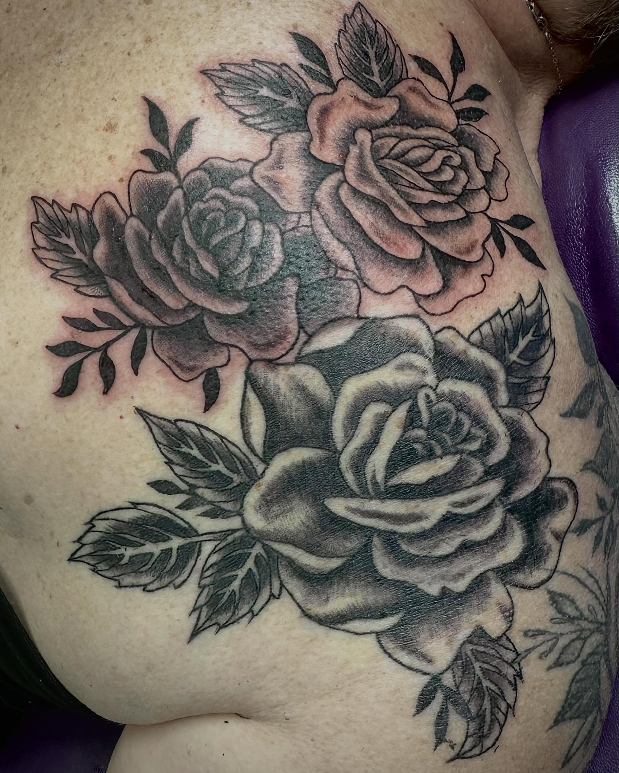 Roses black and grey tattoo on the shoulder by Mikaila Jean