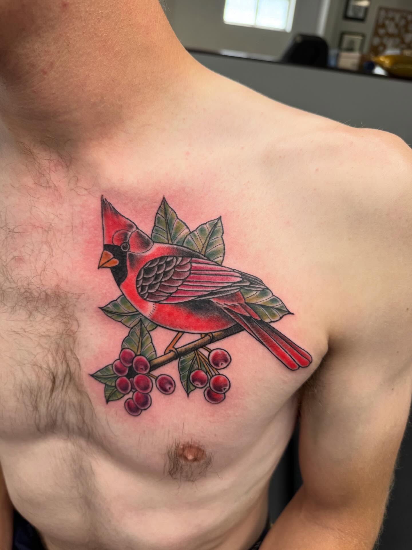 Cardinal bird American traditional tattoo on the chest by Joey Flaherty