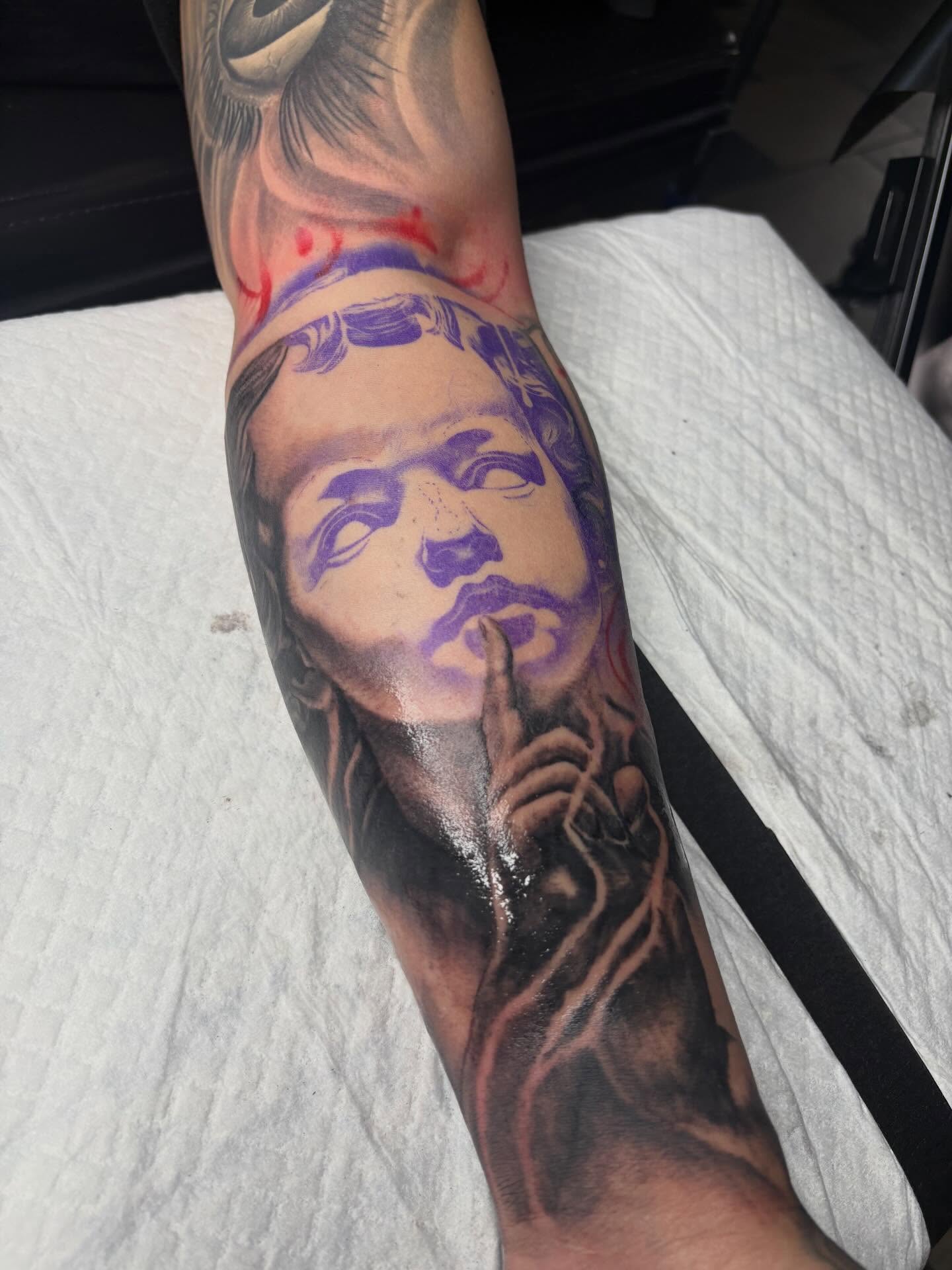 Portrait realism tattoo on the forearm by Trusty Dizon Tattoo Artist