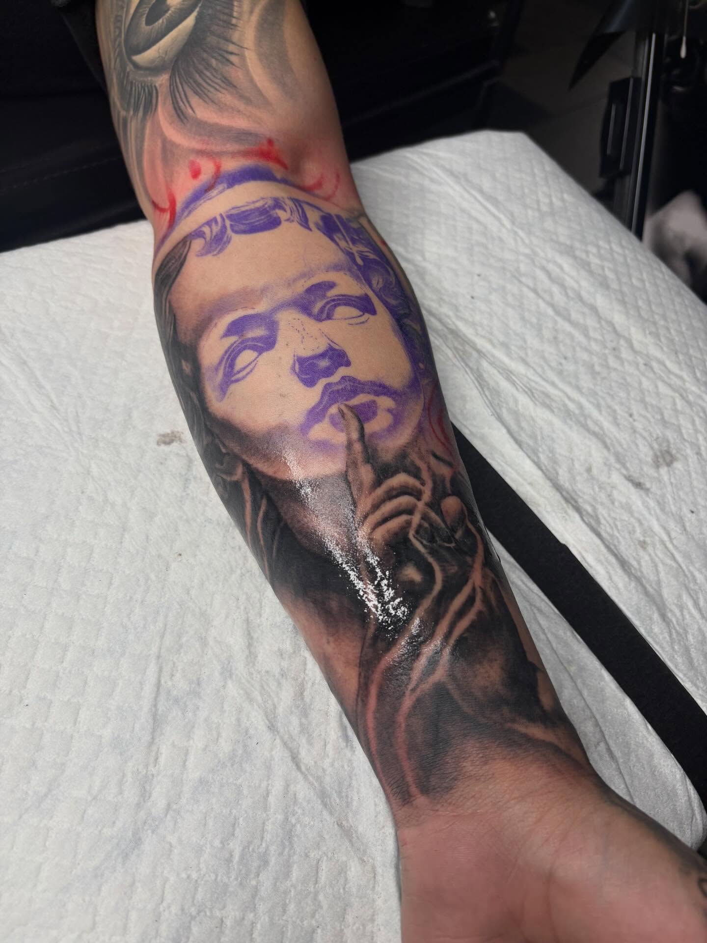 Portrait realism tattoo on the forearm by Trusty Dizon Tattoo Artist