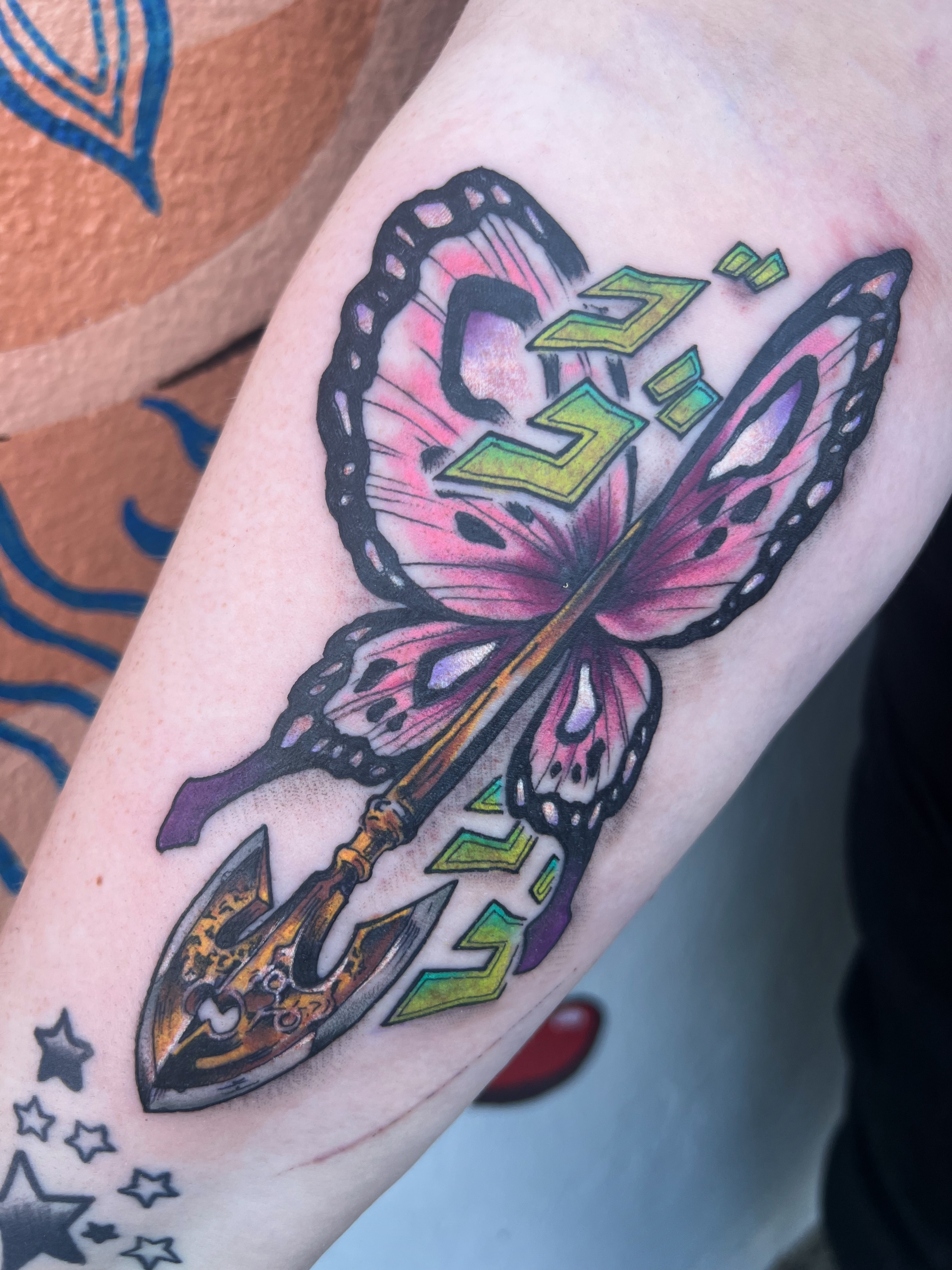 Butterfly and spear new school tattoo on the forearm by Owen Smith -OEOS- SF