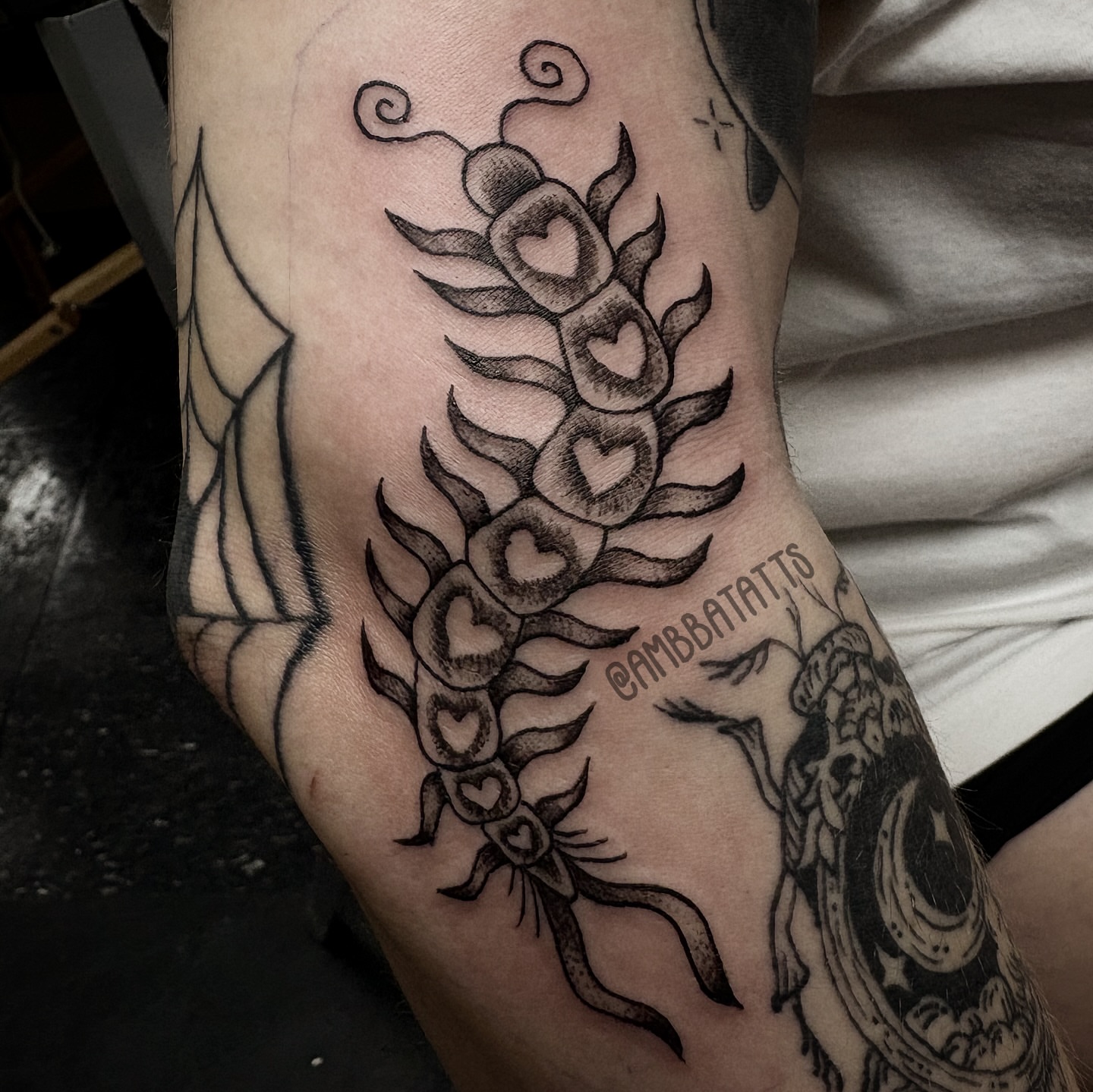 Heart and flame design black and grey tattoo on the forearm by amber brady, Brunswick, Ohio