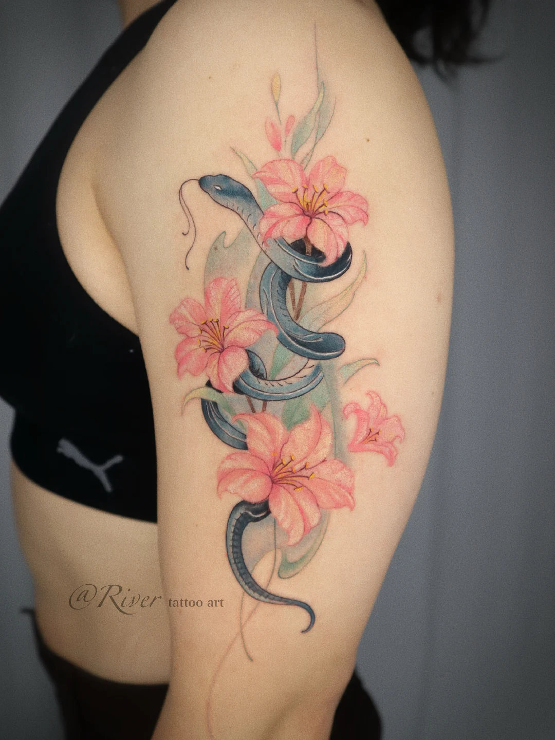 Snake and flowers realism tattoo on the thigh by River