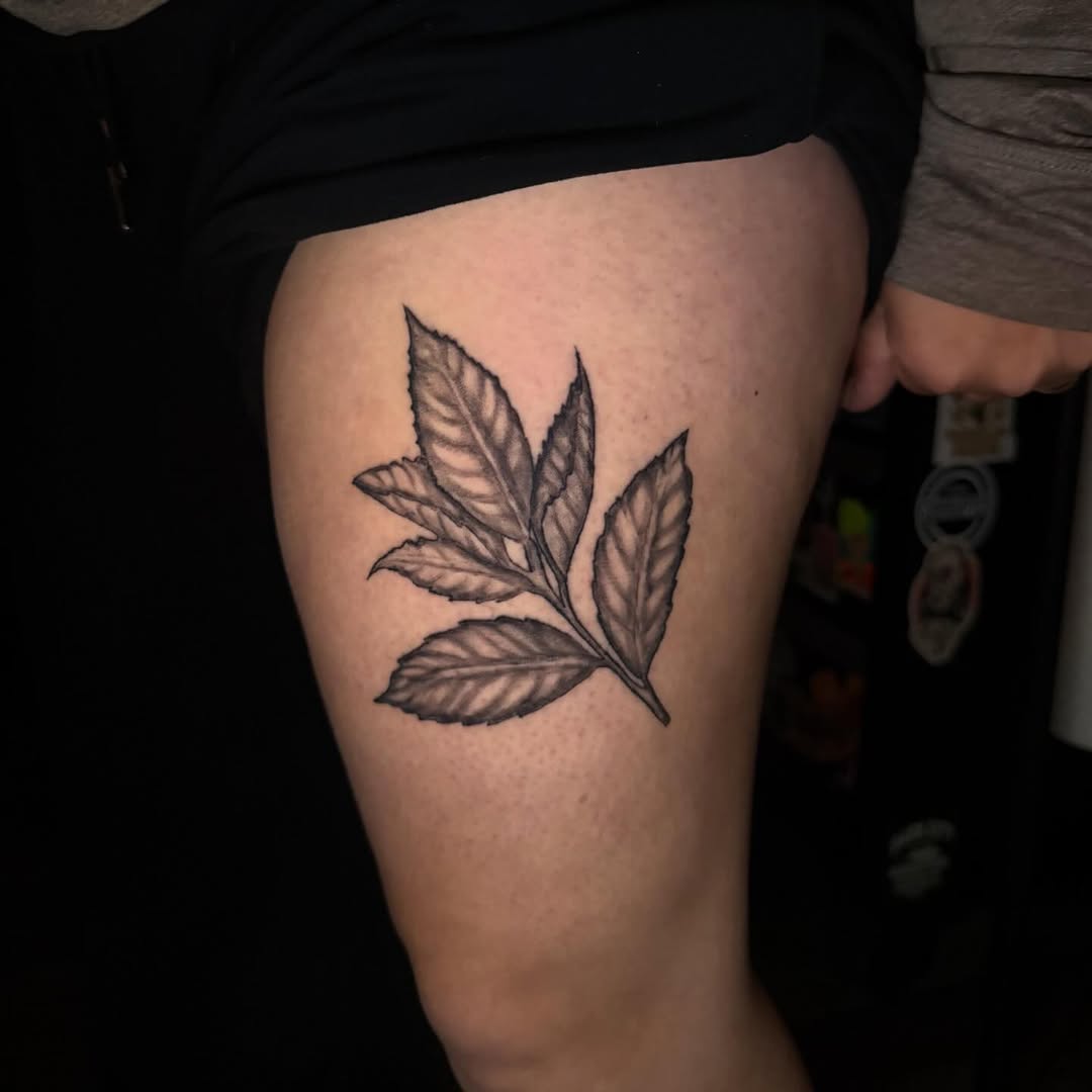 Branch with leaves dotwork tattoo on the thigh by K. Bel Art