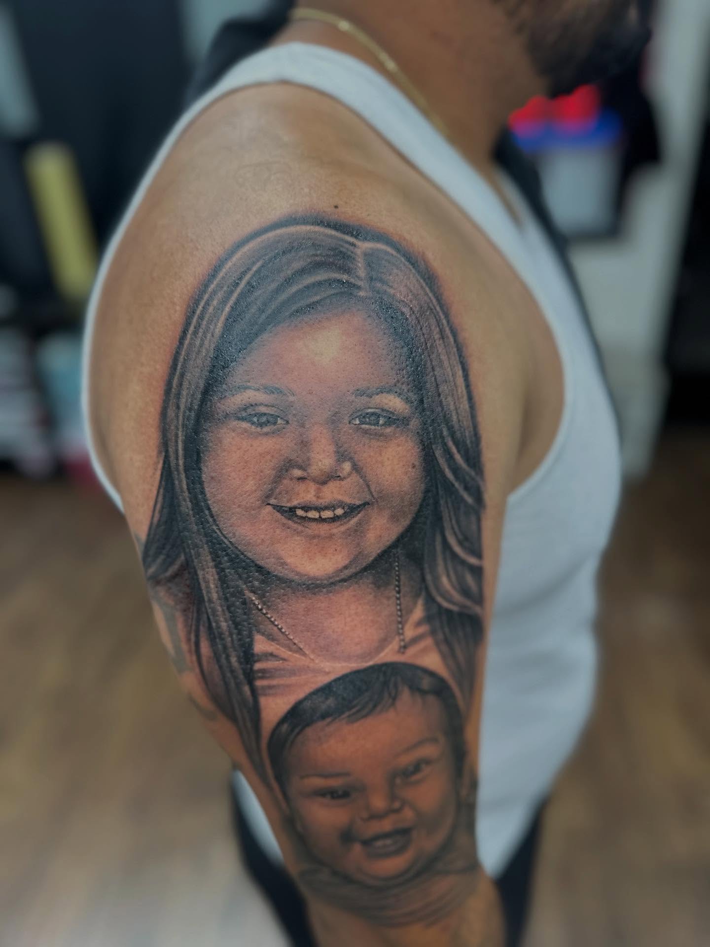 Portrait realism tattoo on the shoulder by Ruben
