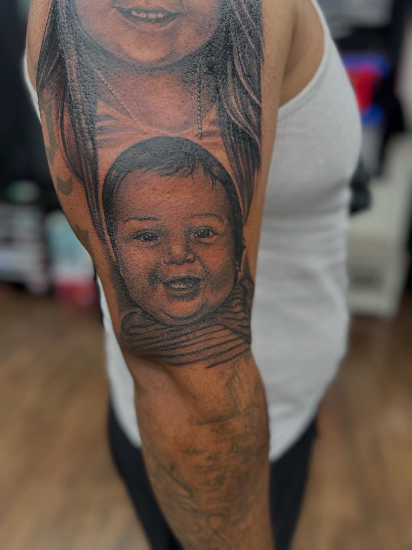 Portrait realism tattoo on the forearm by Ruben