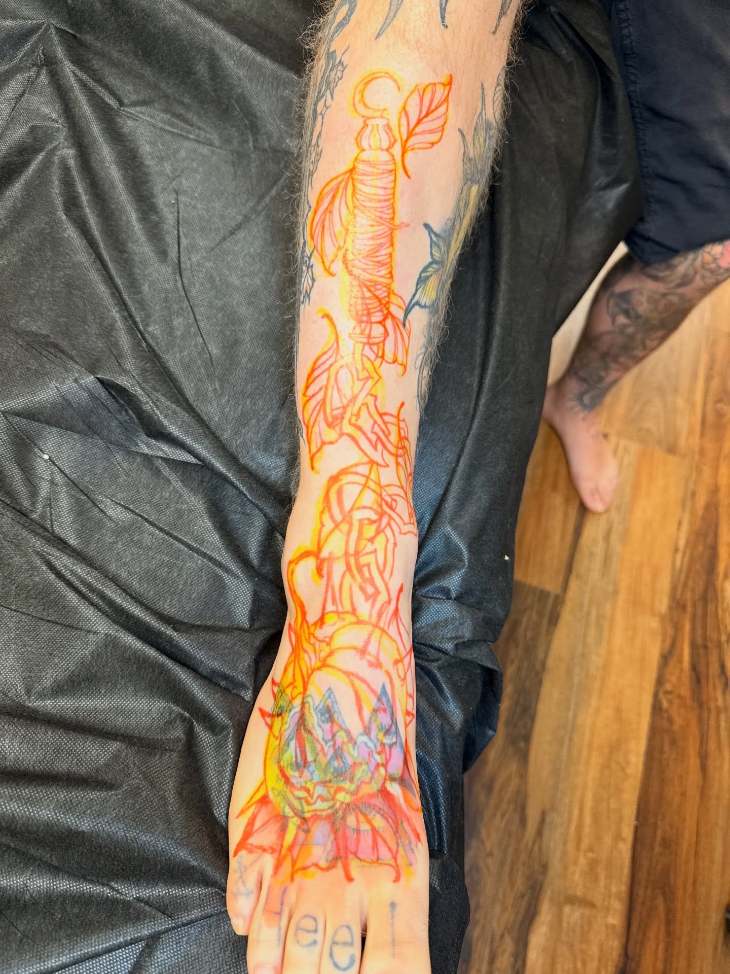 Flame and anchor neo-traditional tattoo on the forearm by Dave Osrowitz