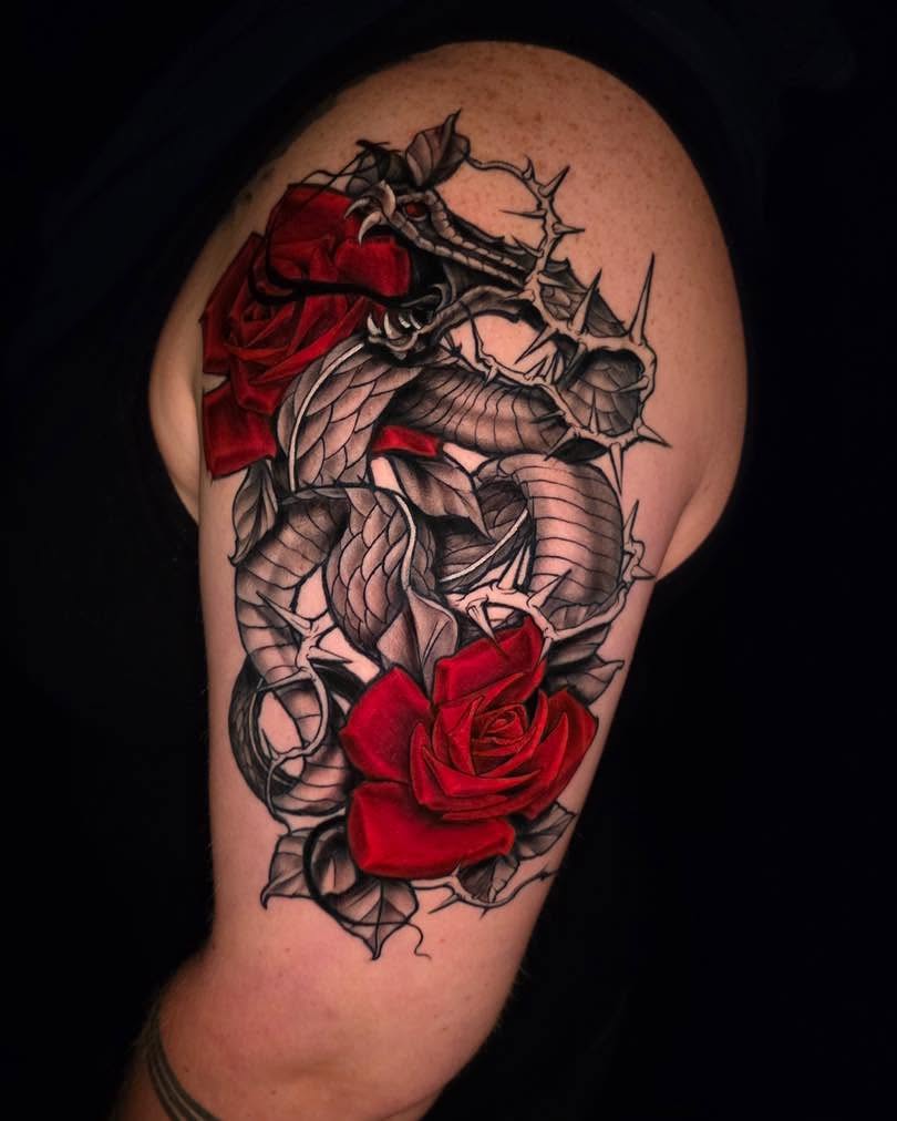 Dragon and roses realism tattoo on the shoulder by Tank Maass