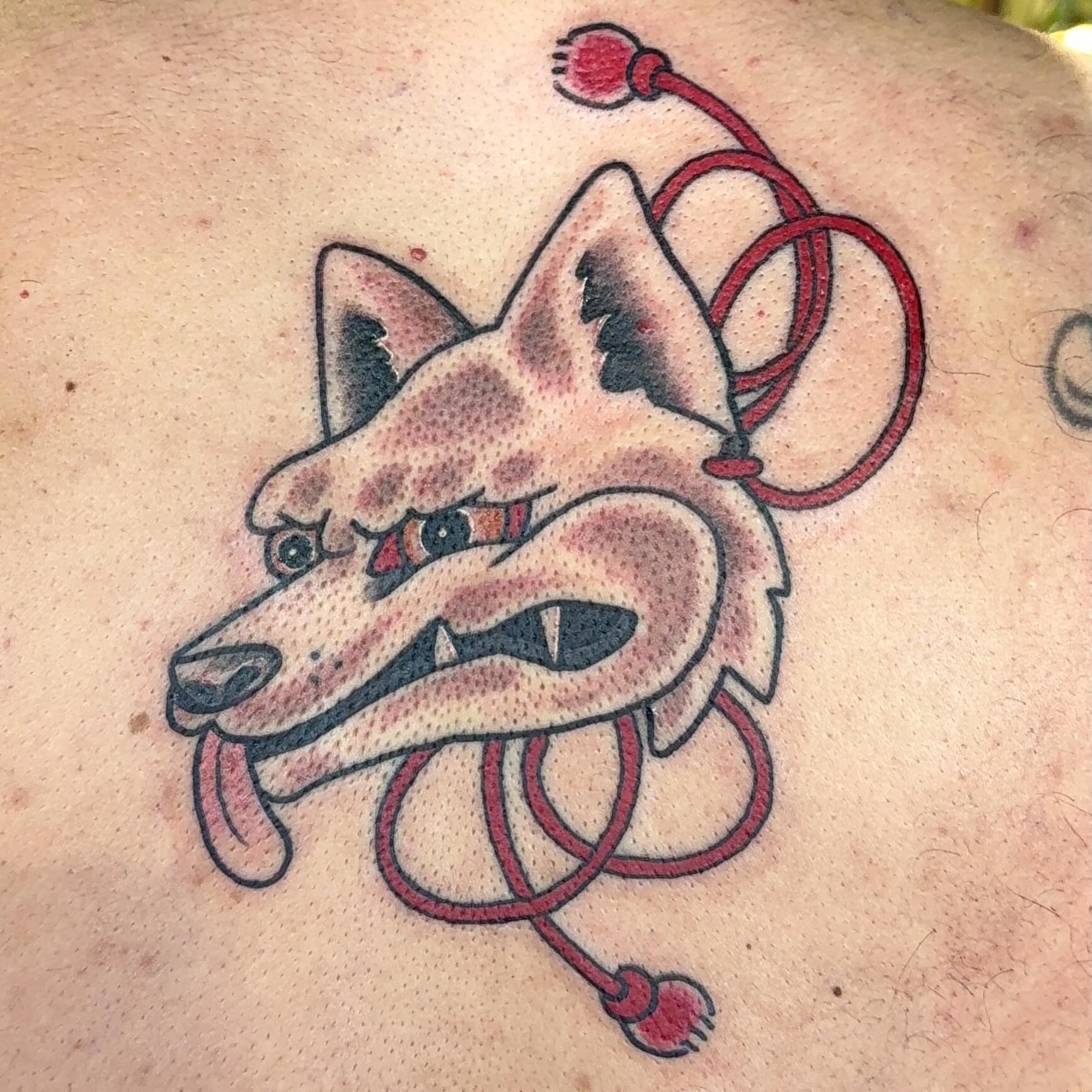 Fox with leash American traditional tattoo on the back by Erin McDavis