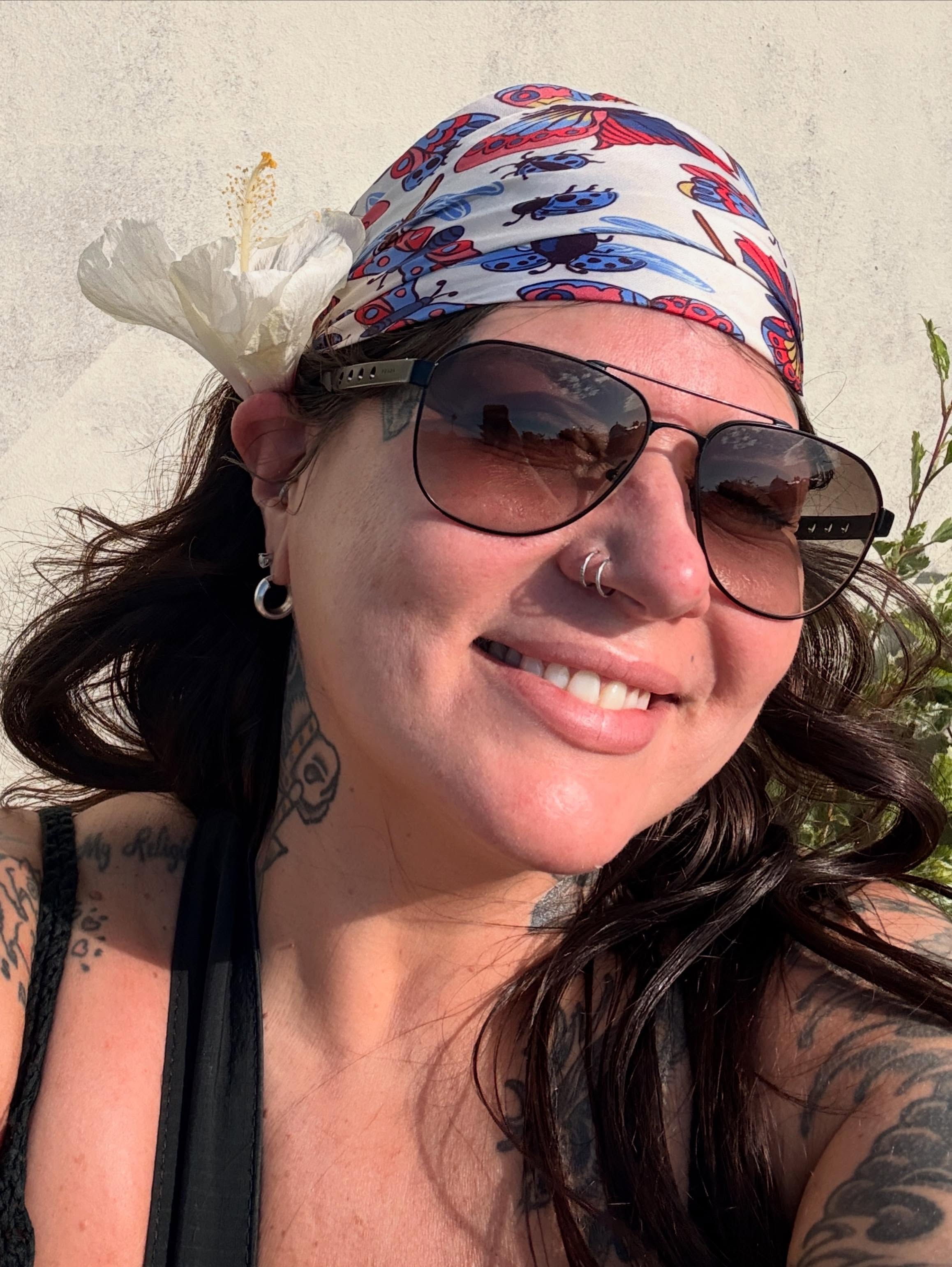 Floral American traditional tattoo on the head by Megan Sue Causemaker