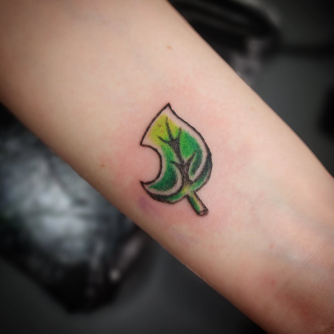 Leaf symbol new school tattoo on the forearm by Anntonietta Borzacchiello