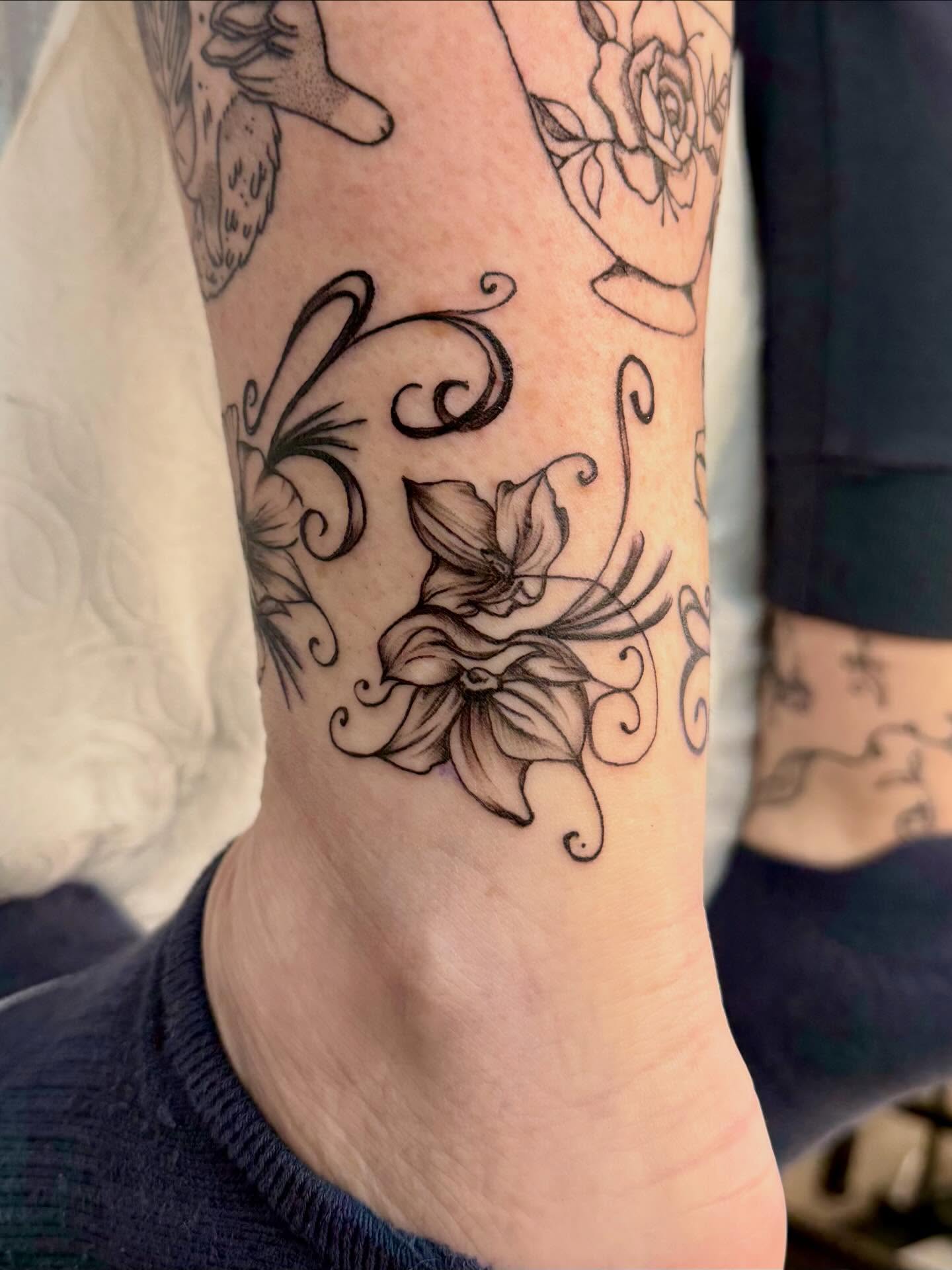 Lily flowers black and grey tattoo on the calf by Peggy