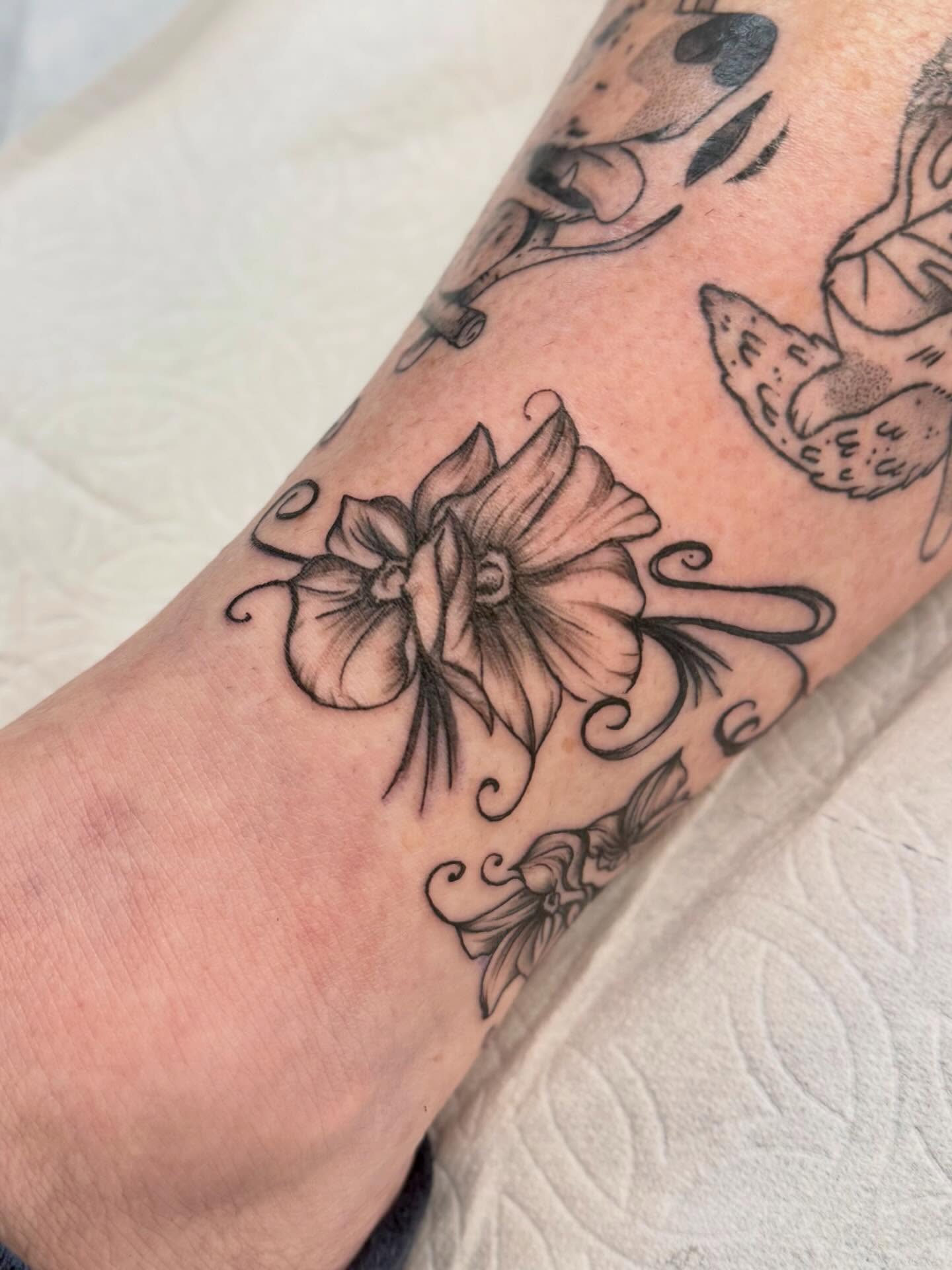 Flower black and grey tattoo on the forearm by Peggy