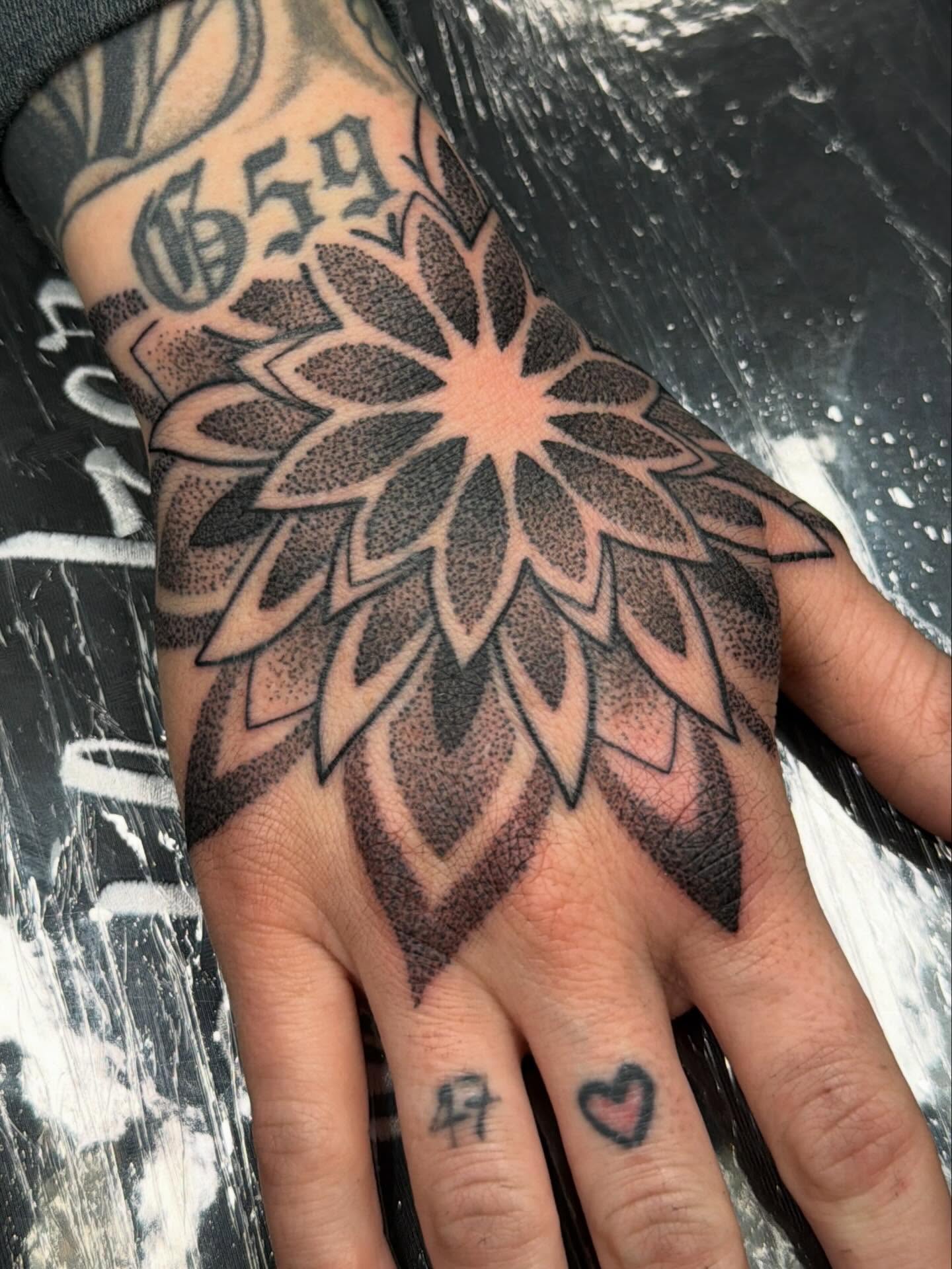 Dahlia flower dotwork tattoo on the hand by Las Vegas Tattoo Artist, Las Vegas, Nevada