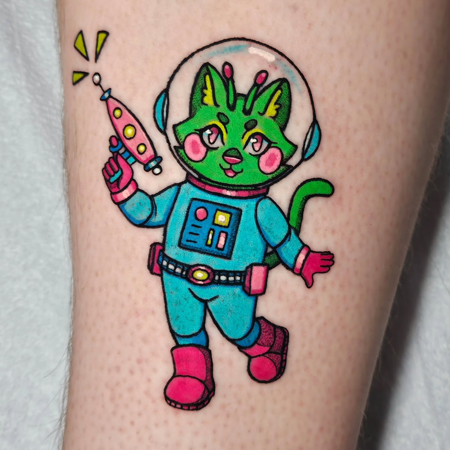 Space cat astronaut new school tattoo on the forearm by Gray