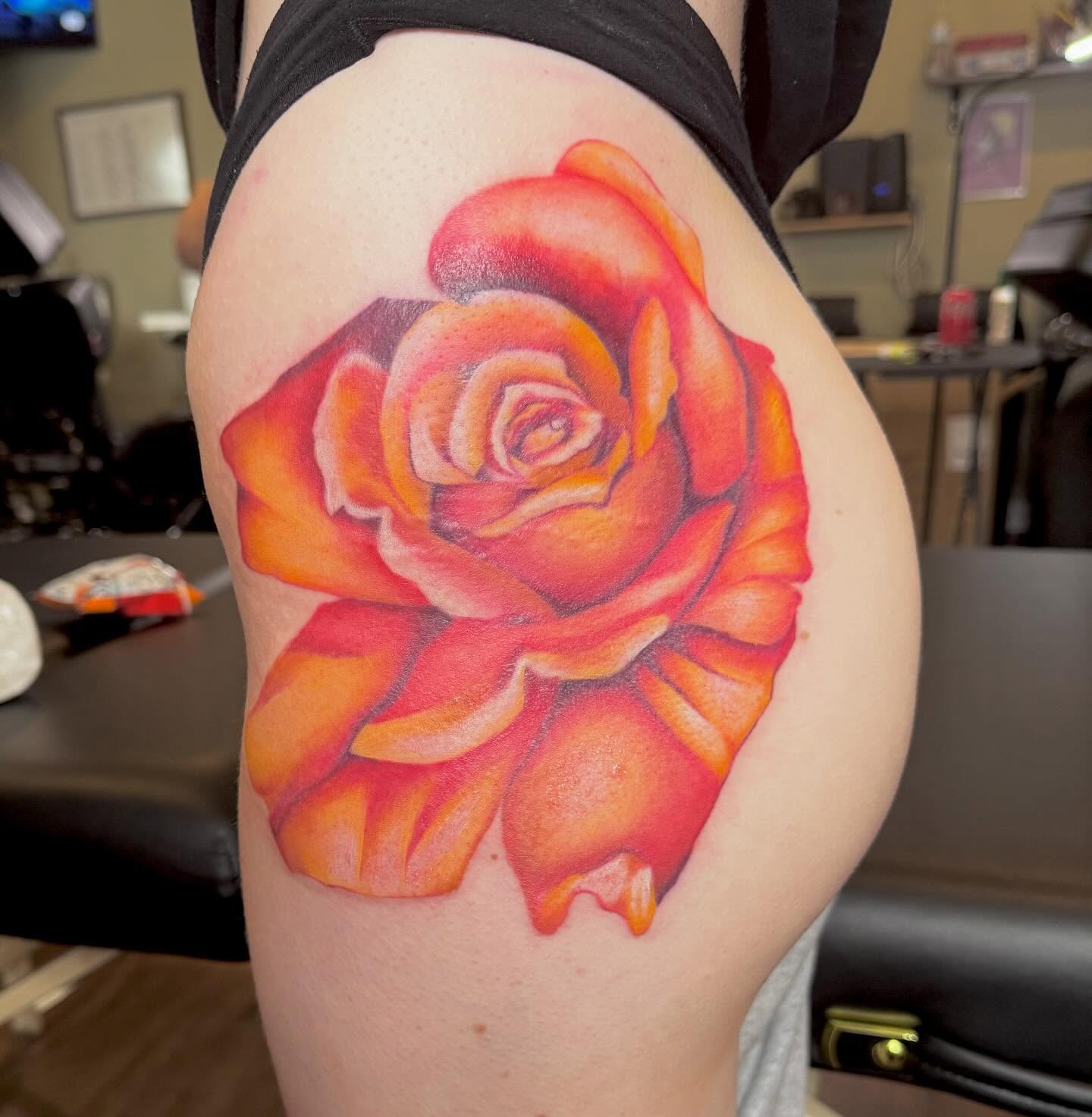 Rose realism tattoo on the thigh by Cohen