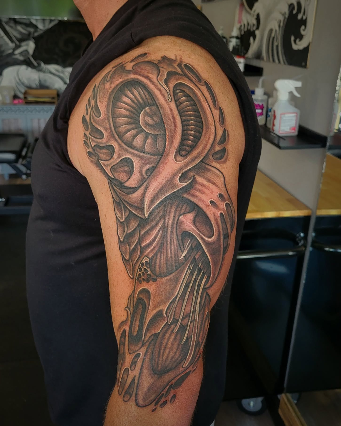 Ram skull black and grey tattoo on the shoulder by Danny Stewart