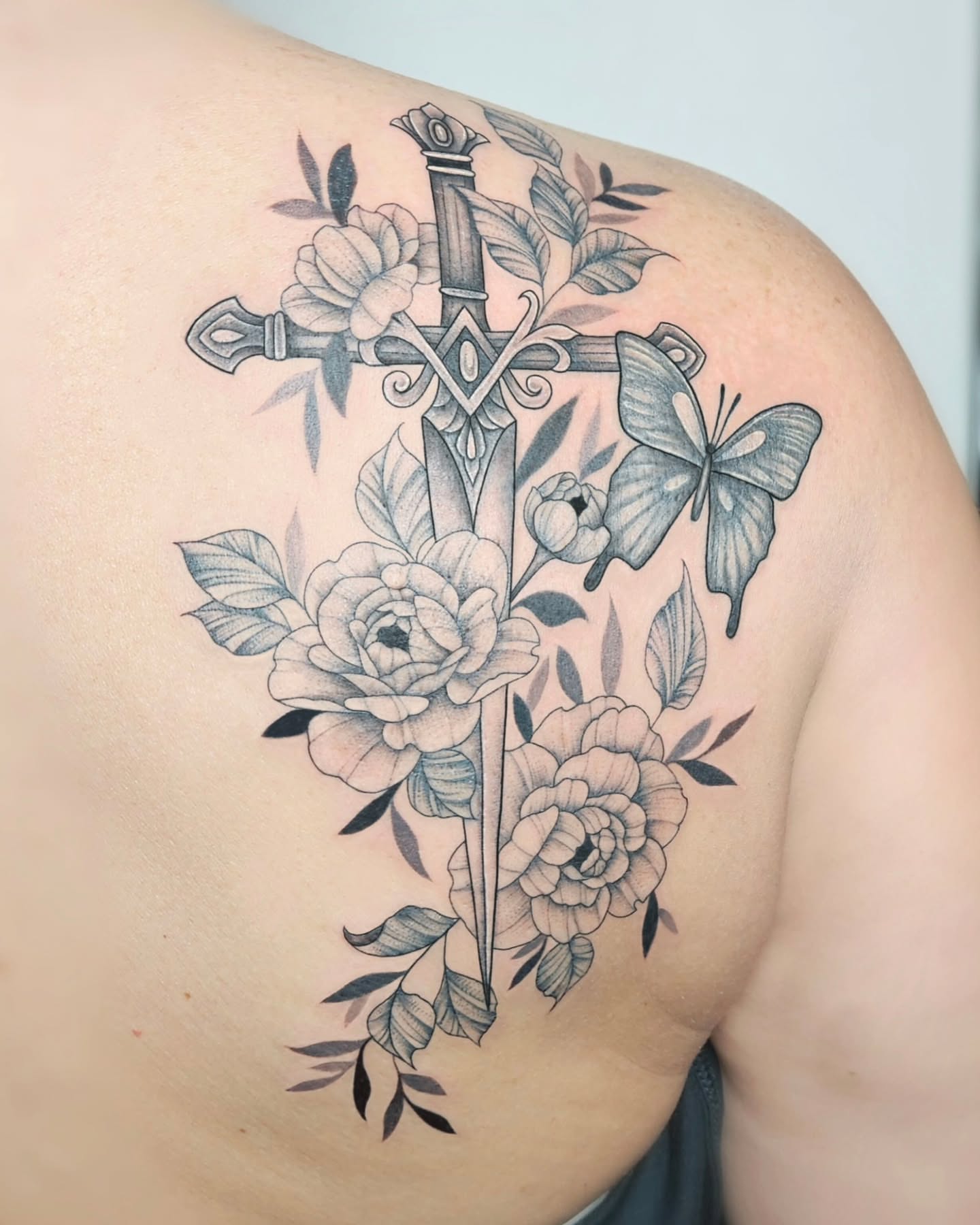 Sword and flowers realism tattoo on the shoulder by TaylorLeighShermanTattoos OFFICIAL