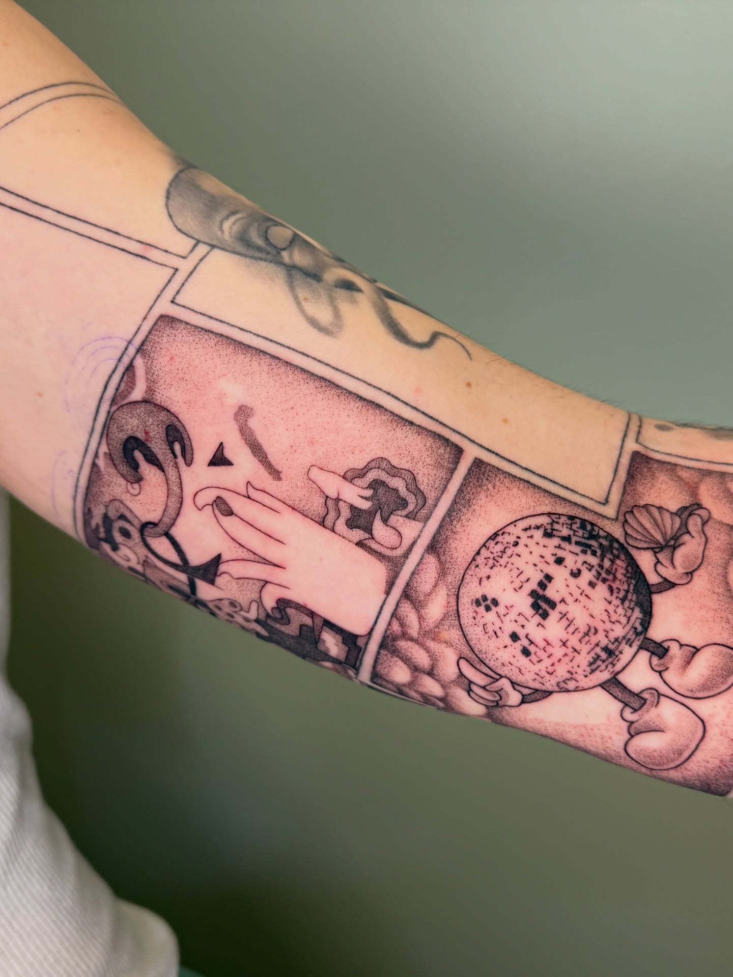 Comic strip dotwork tattoo on the forearm by Koryn Donnelly
