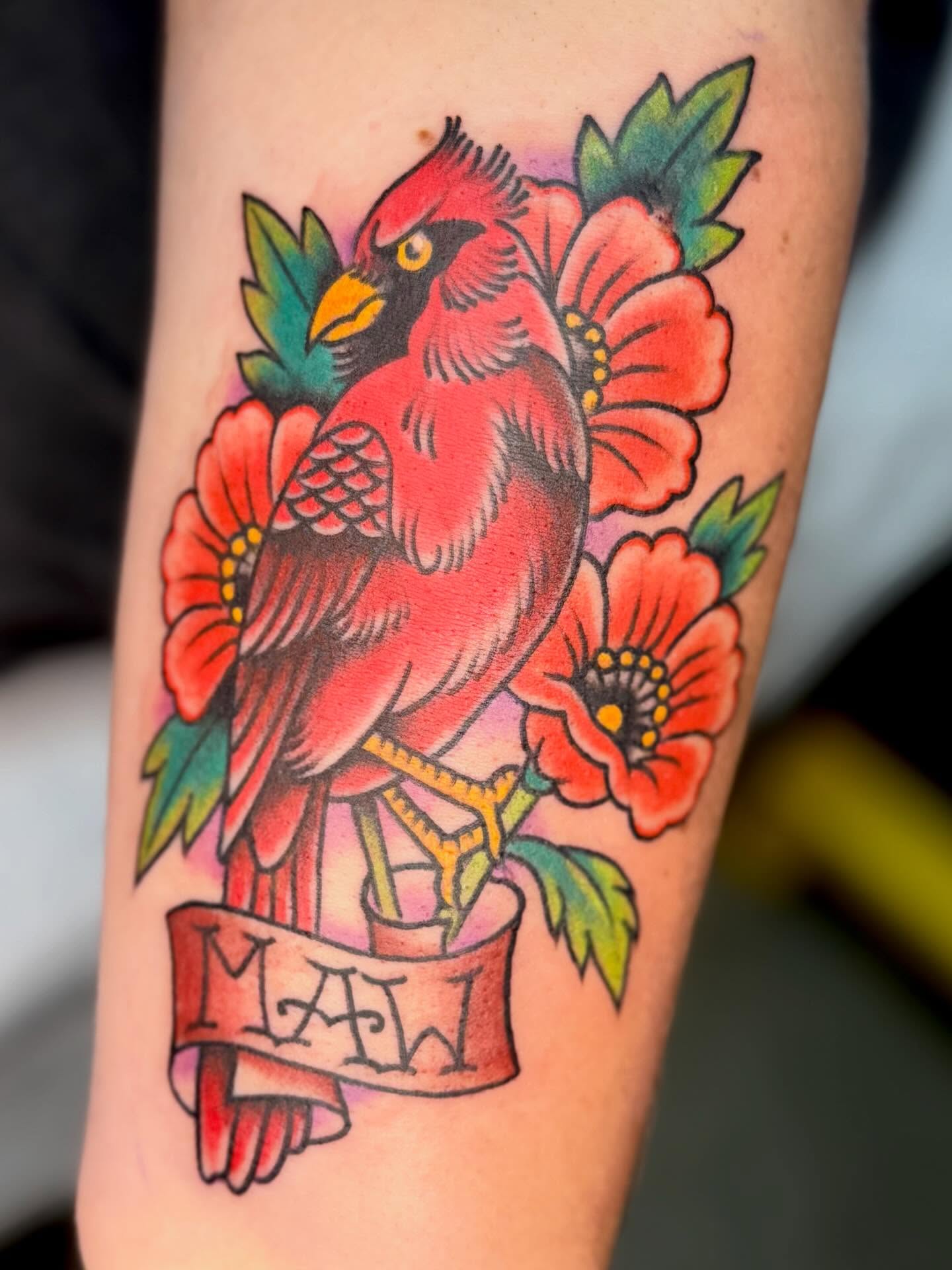 Cardinal and flowers American traditional tattoo on the forearm by KevinBetsch