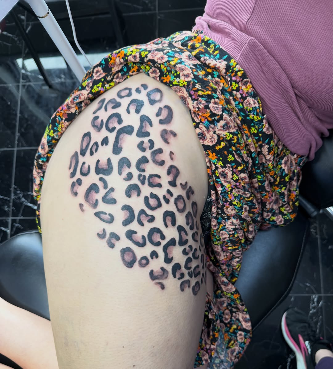 Leopard print dotwork tattoo on the thigh by Jinx Ryder