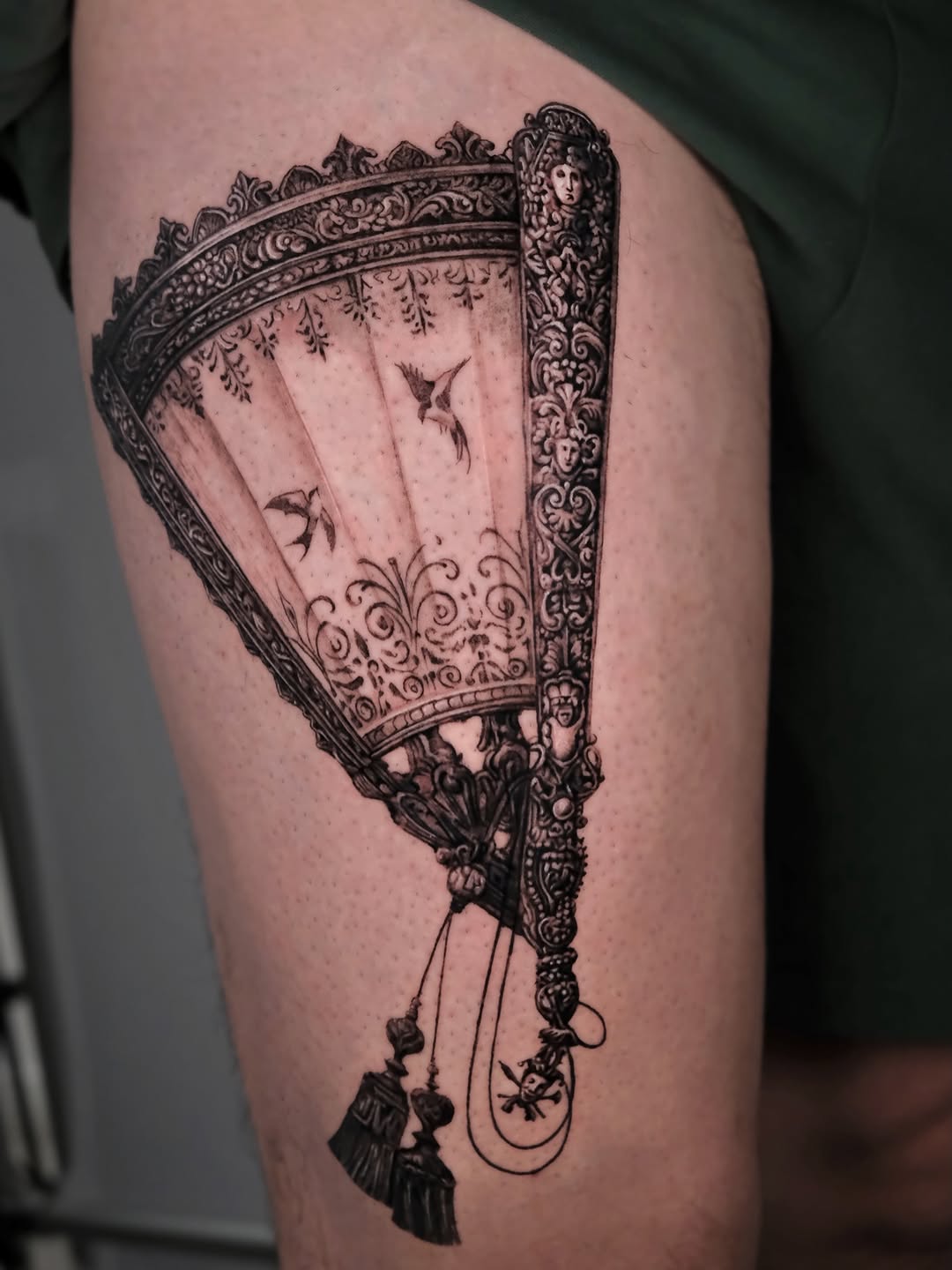 Ornate fan with birds fine line tattoo on the thigh by Da-An ･ﾟ✧ 다 안 𓇬˖