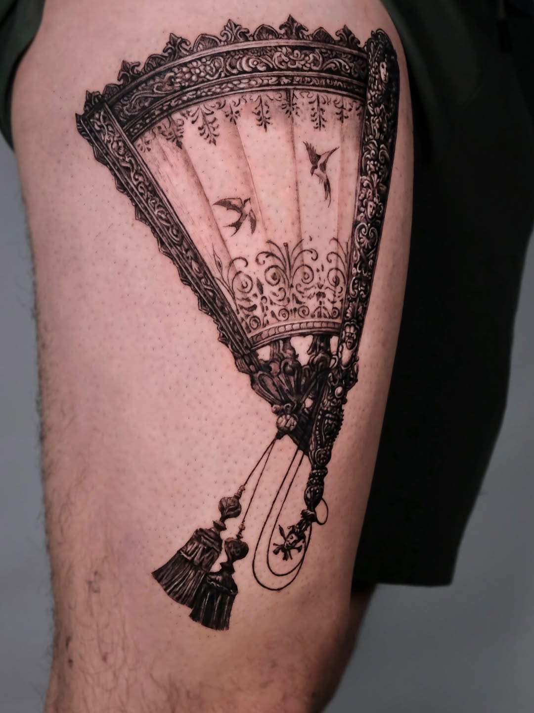 Ornate fan with birds fine line tattoo on the thigh by Da-An ･ﾟ✧ 다 안 𓇬˖