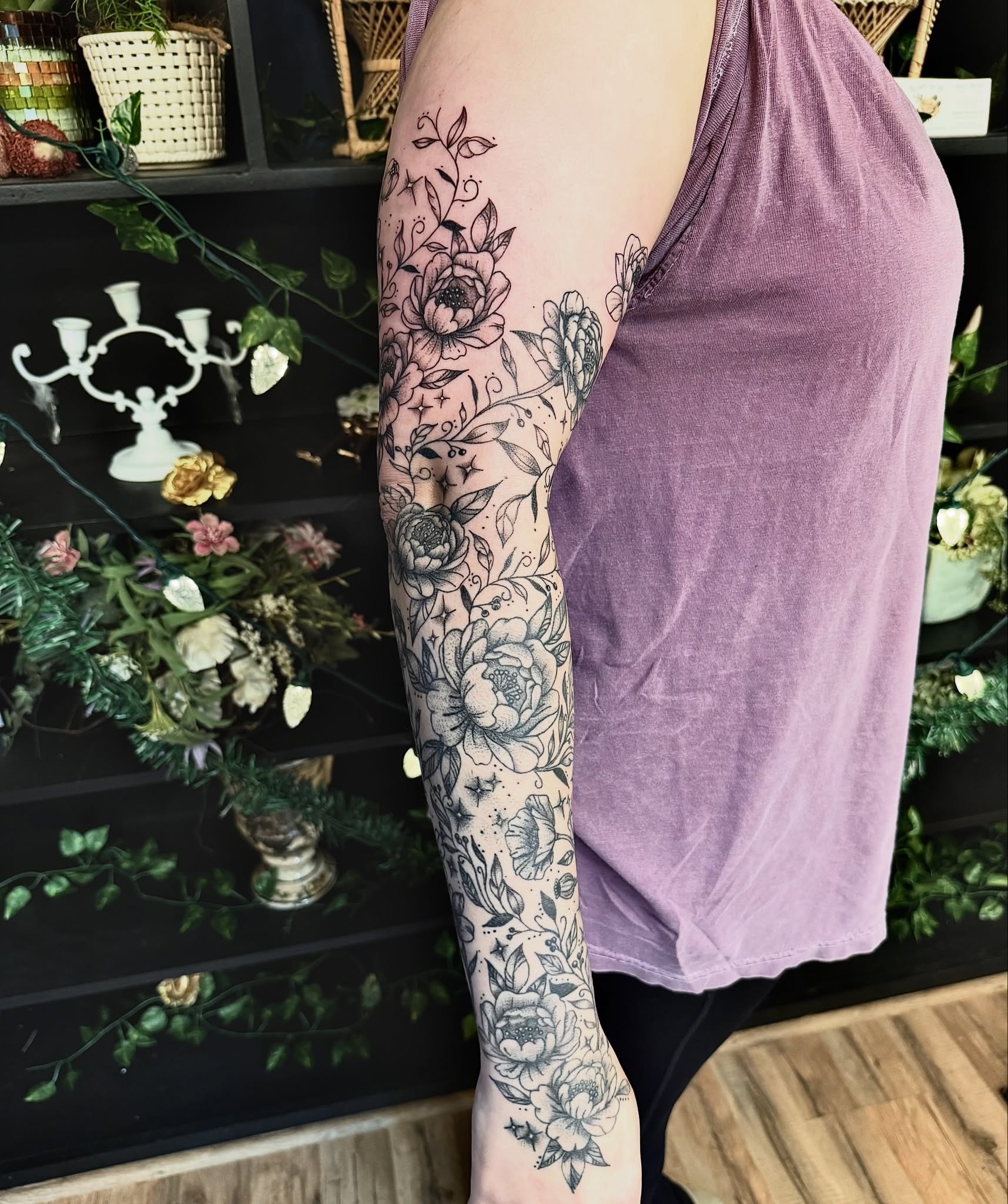 Floral bouquet black and grey tattoo on the forearm by Haley Bates