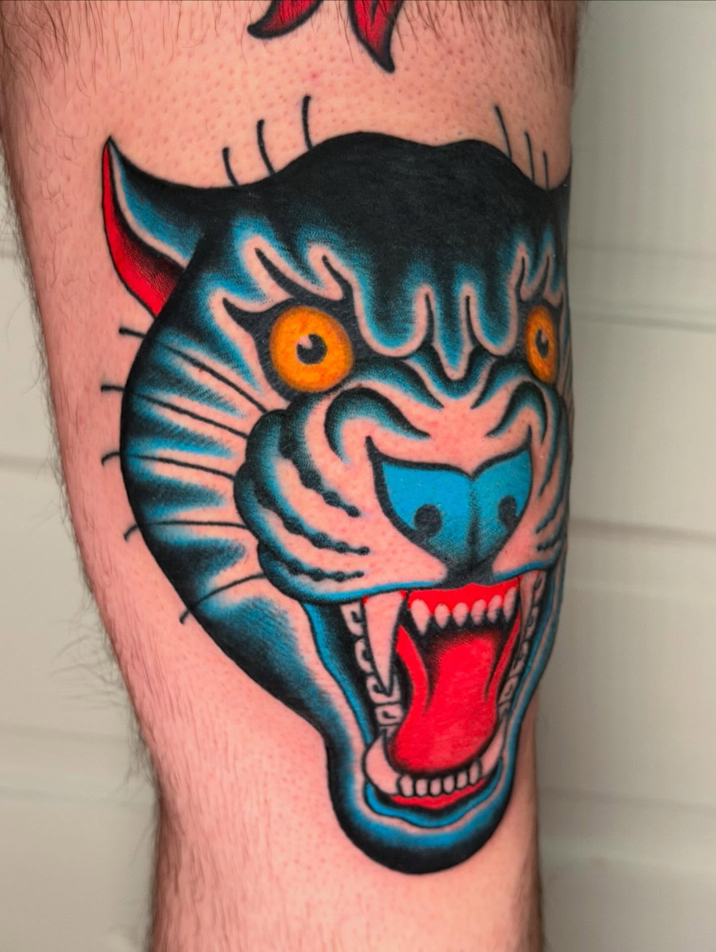 Roaring tiger American traditional tattoo on the forearm by Michael Barnhill Tattooer, Charlotte, North Carolina