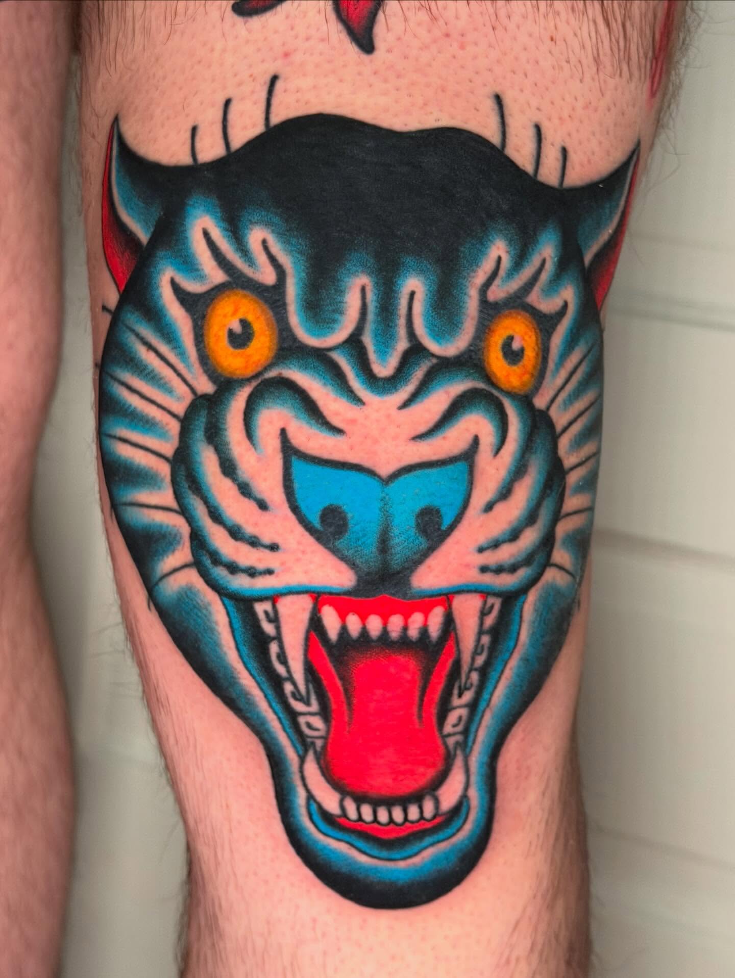 Roaring tiger American traditional tattoo on the forearm by Michael Barnhill Tattooer, Charlotte, North Carolina