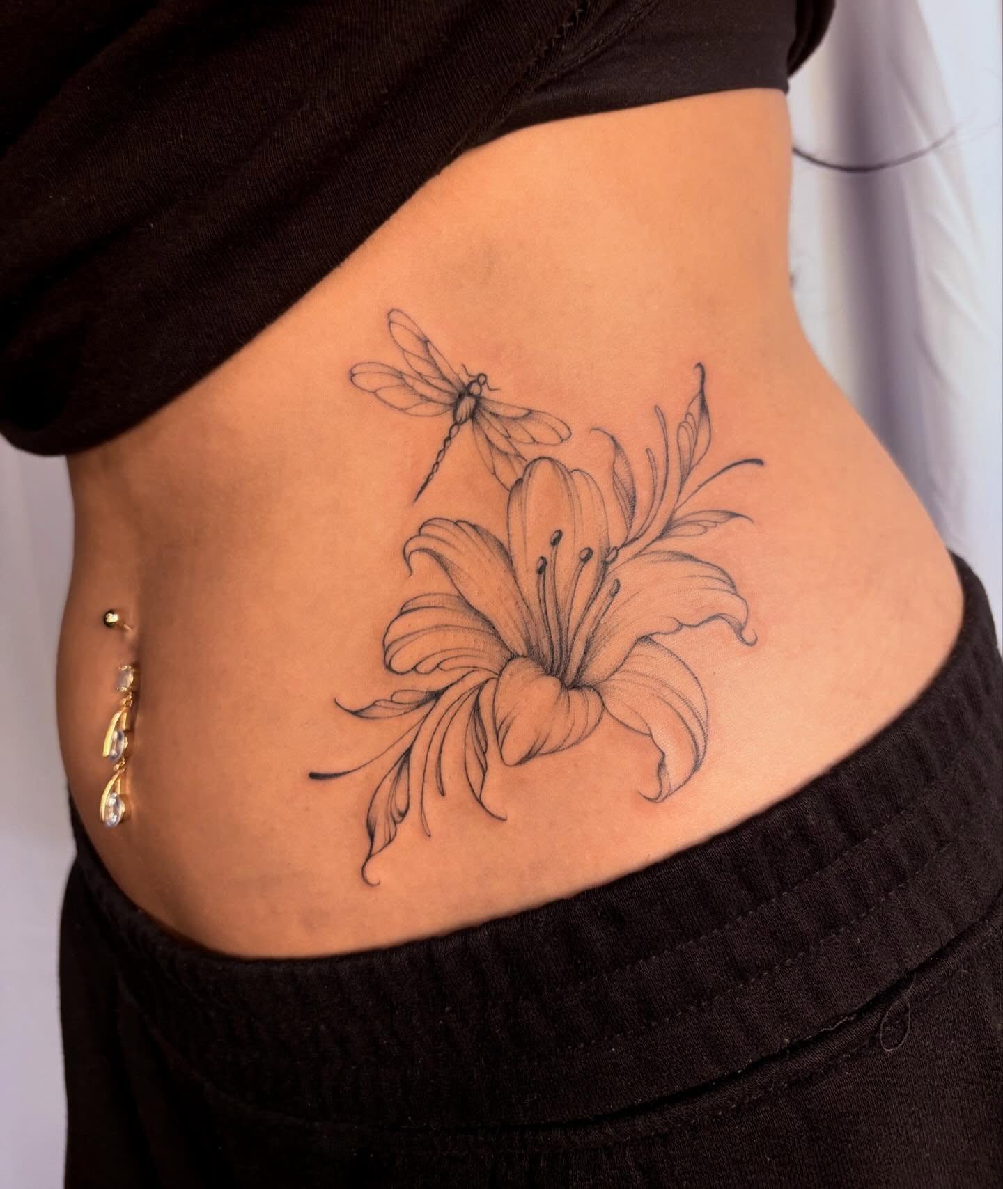 Lily and dragonfly realism tattoo on the torso by ꩜ 𖦹