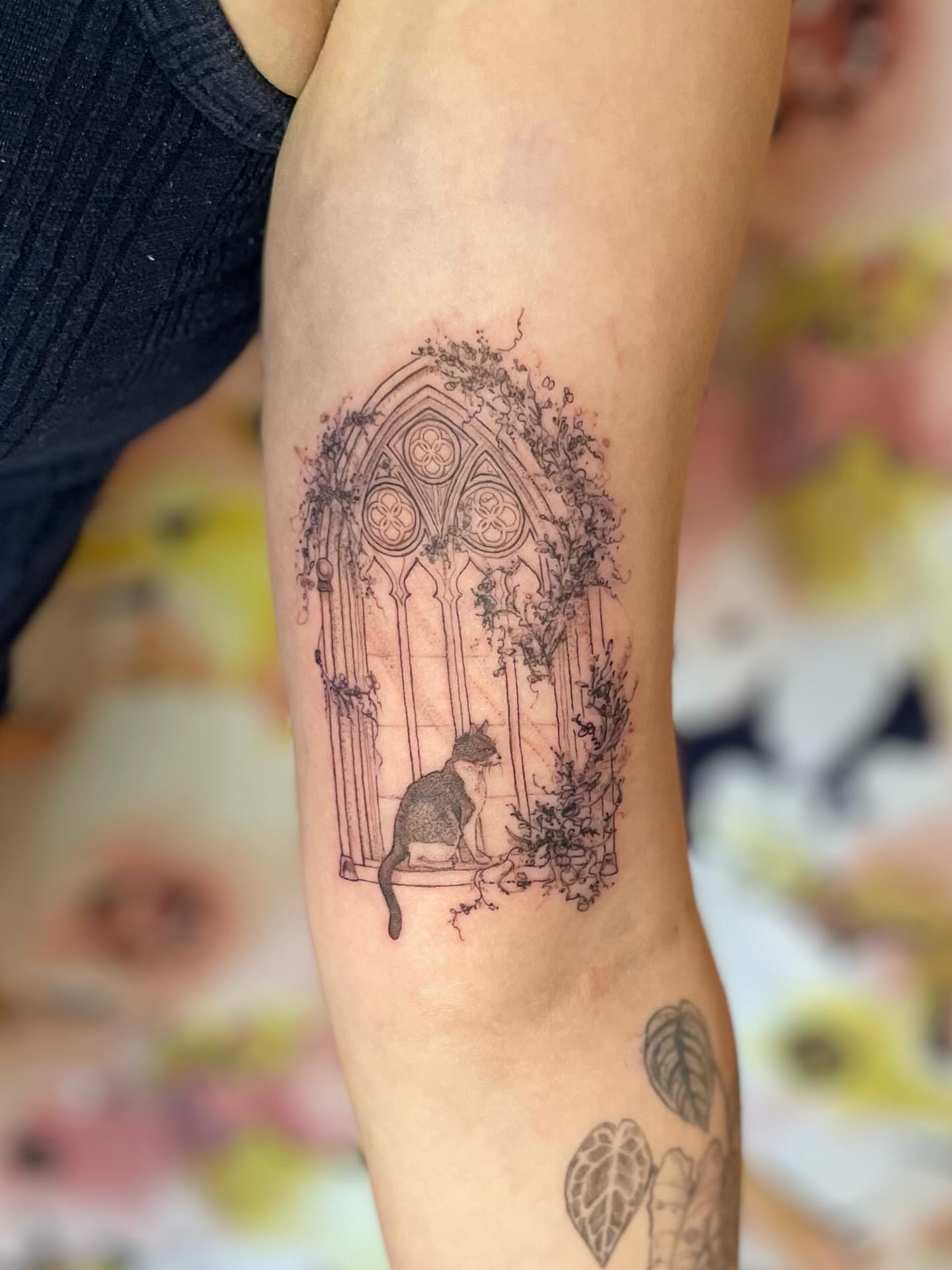Gothic window with cat realism tattoo on the forearm by paige  l  ink shrink tattoo