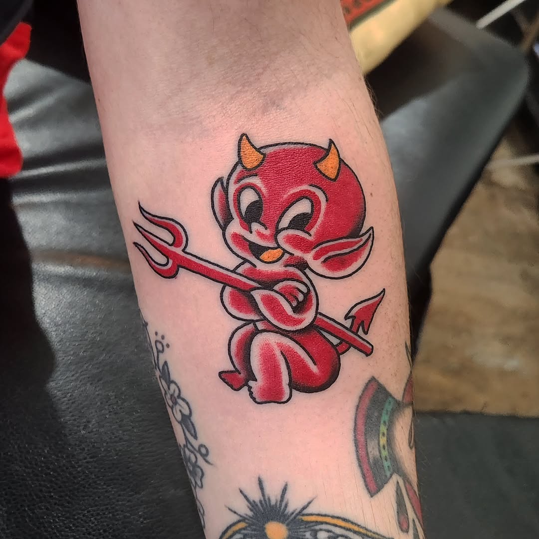Devil American traditional tattoo on the forearm by Douglas Grady