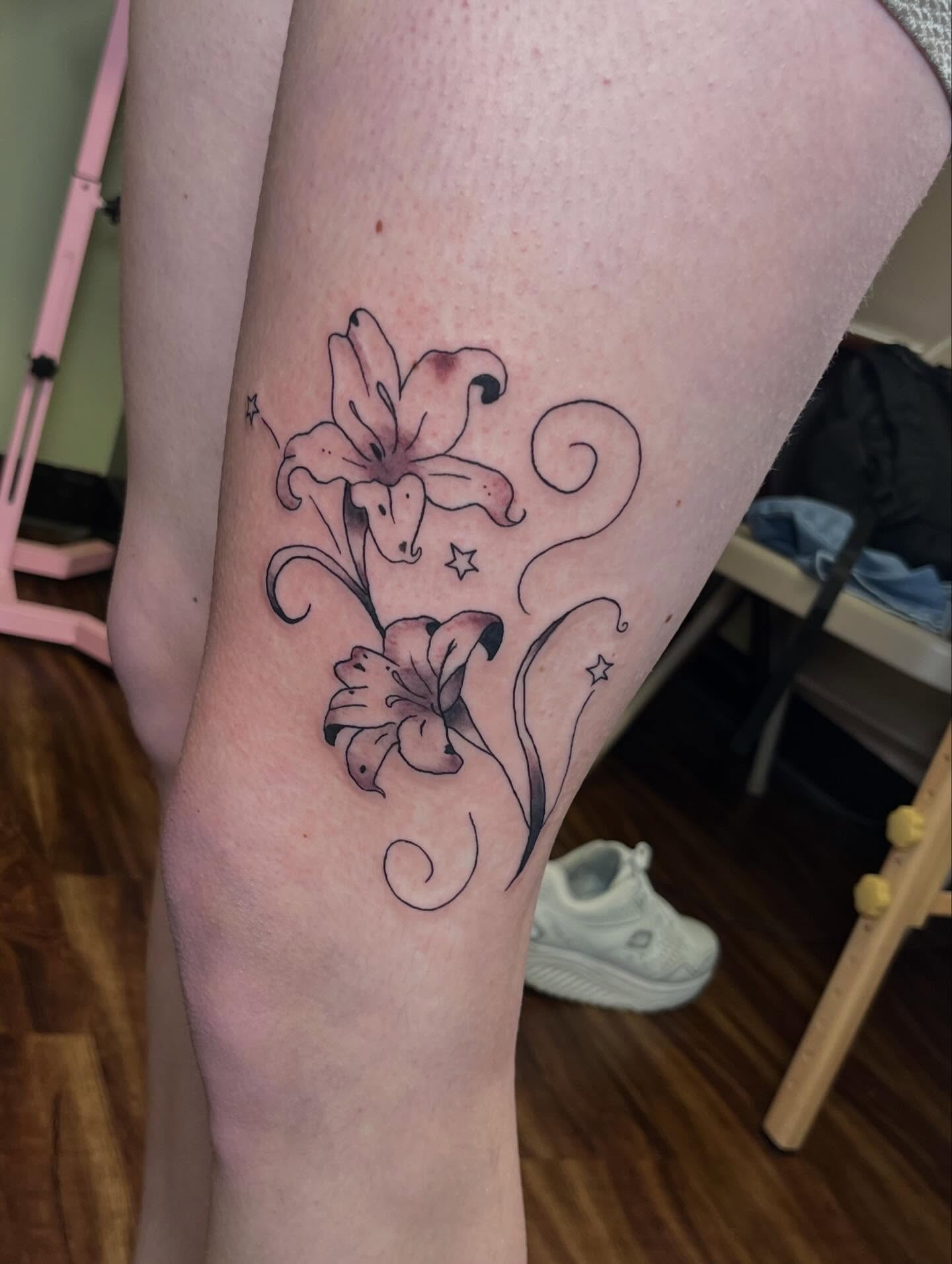 Lilies black and grey tattoo on the forearm by Jazzy