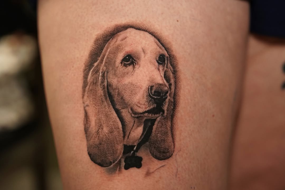 Dog portrait realism tattoo on the thigh by Remko