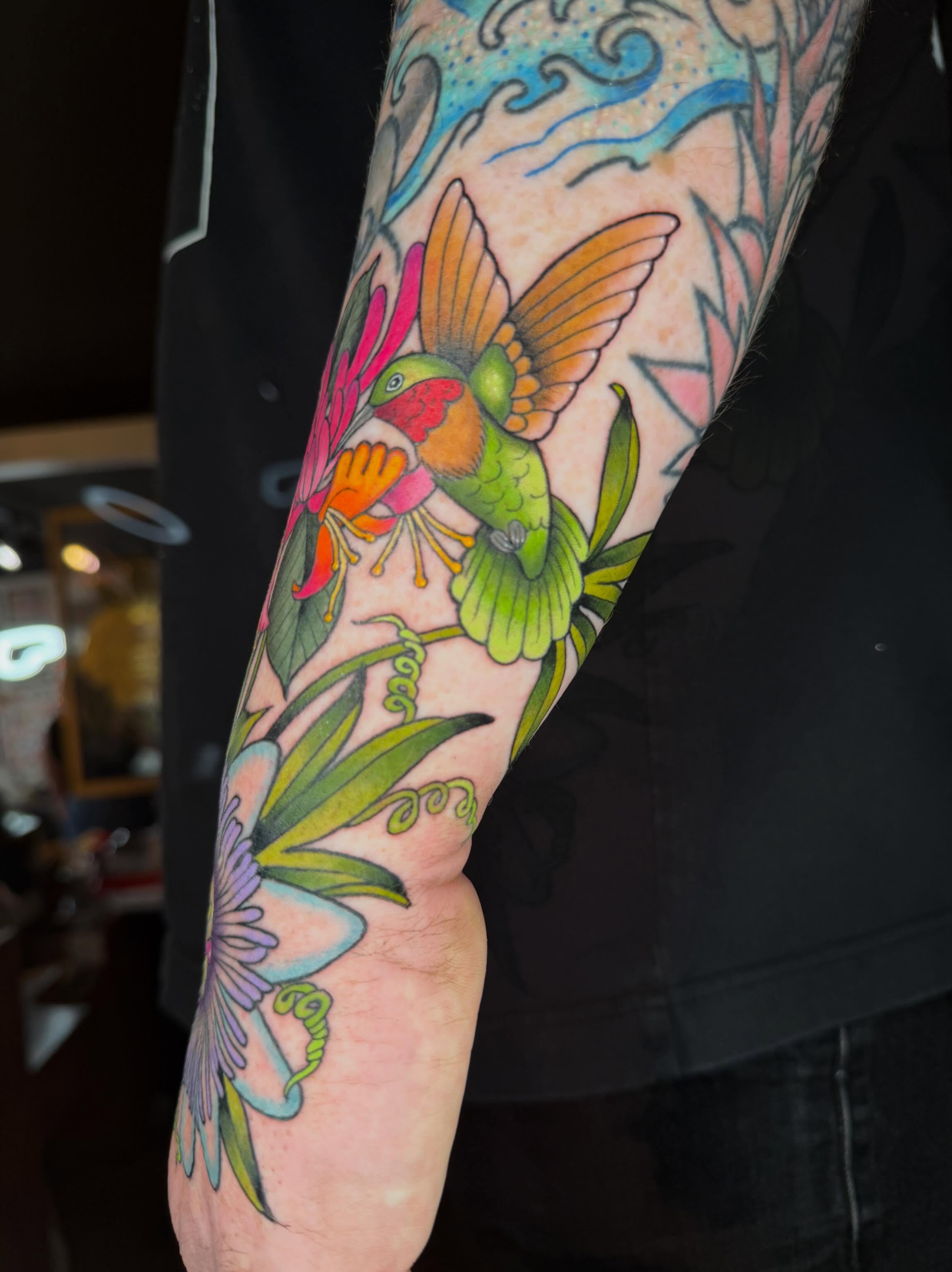 Hummingbird and flowers American traditional tattoo on the forearm by ♥︎ ᴅᴇᴠ ʀᴇɴᴇᴇ ♥︎
