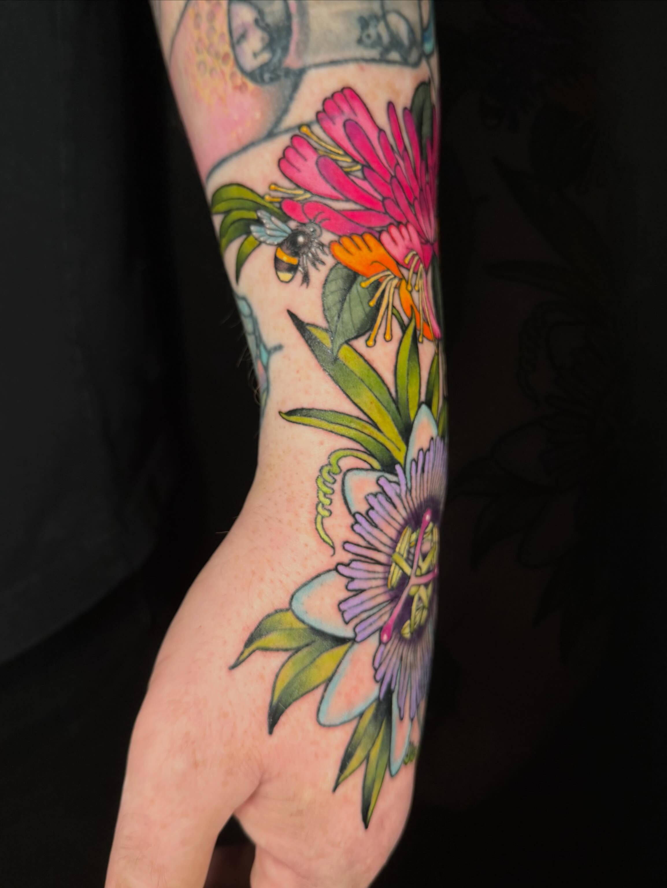 Passion flower and bee American traditional tattoo on the forearm by ♥︎ ᴅᴇᴠ ʀᴇɴᴇᴇ ♥︎