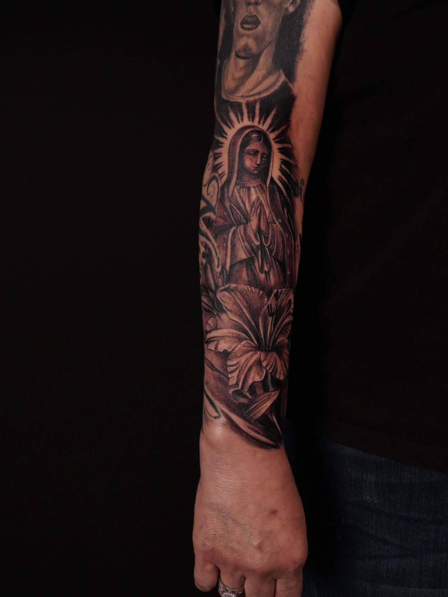 Religious figure black and grey tattoo on the forearm by @tattoobytats