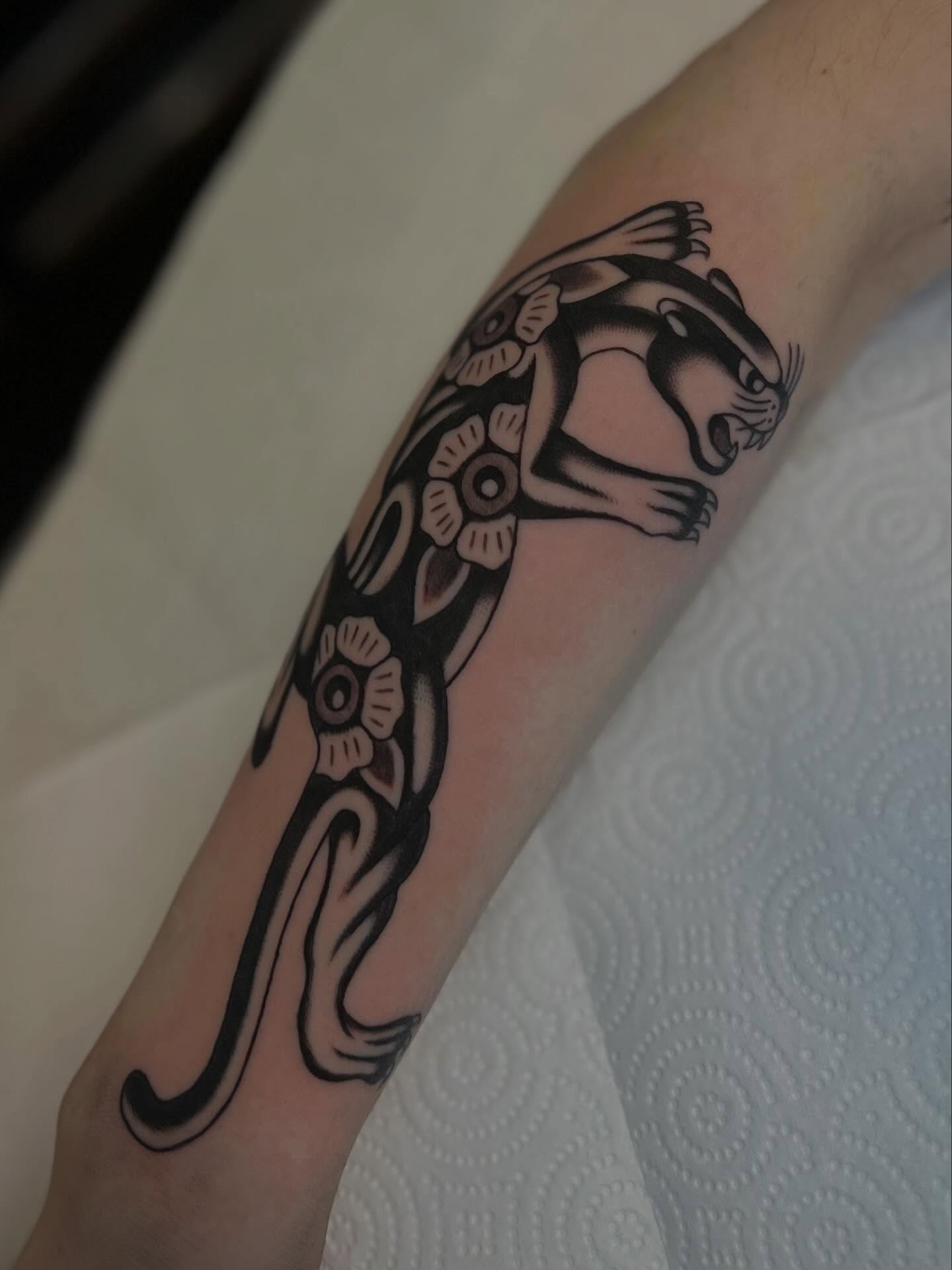 Otter black and grey tattoo on the forearm by Syd Sayyah
