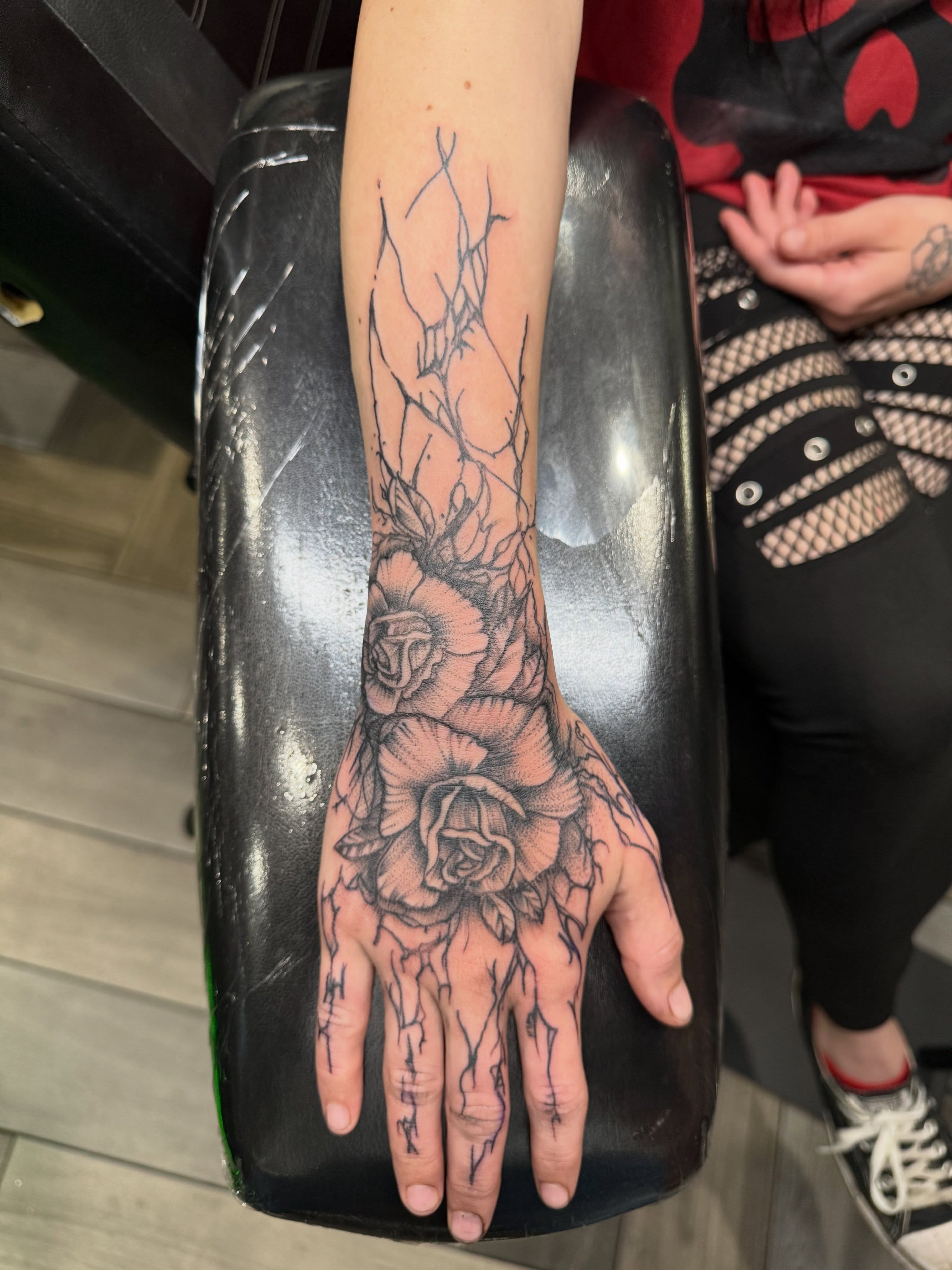 Hand with roses black and grey tattoo on the hand by Dave Potavin, Erlanger, Kentucky