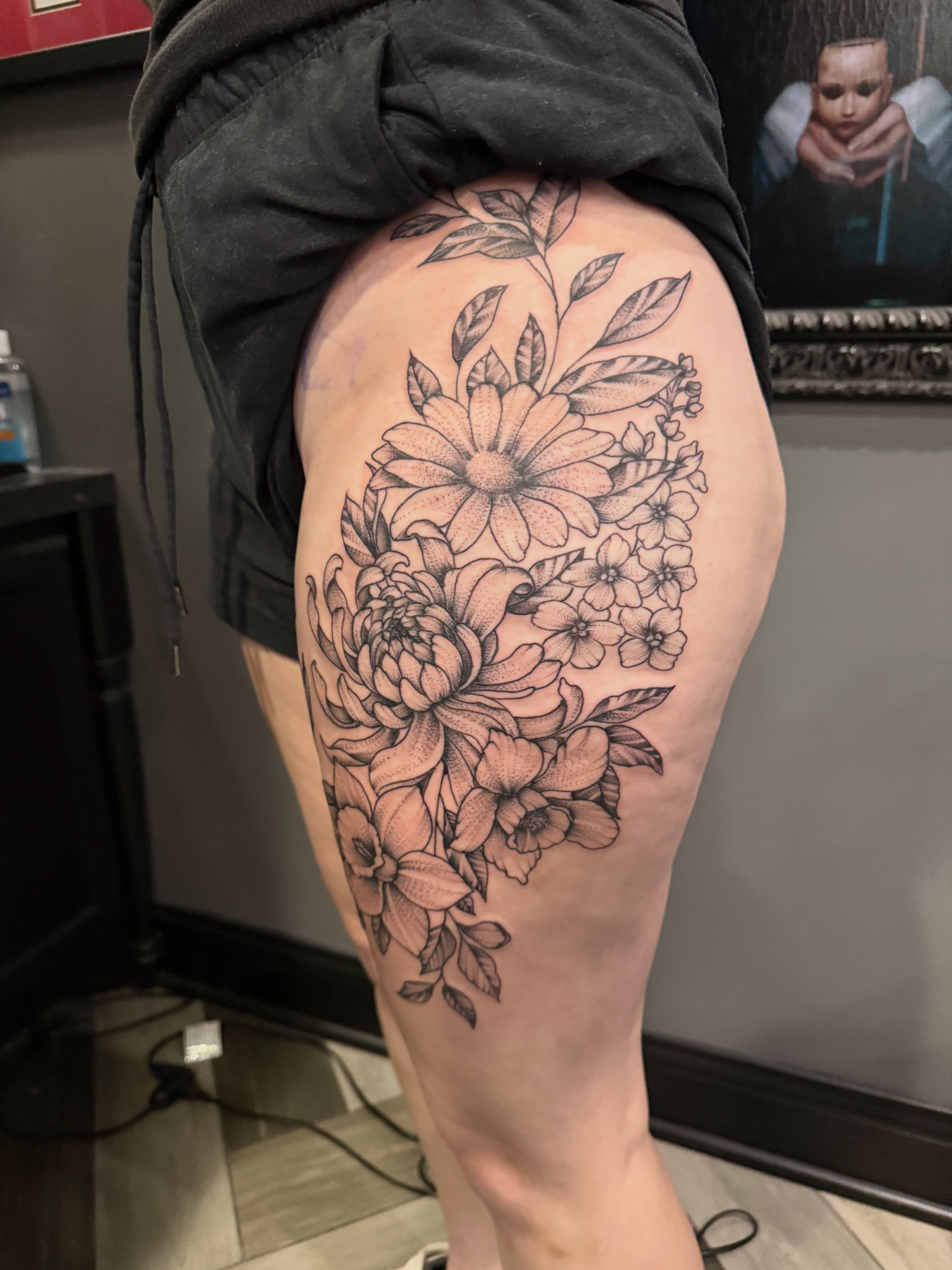 Floral bouquet black and grey tattoo on the thigh by Dave Potavin, Erlanger, Kentucky