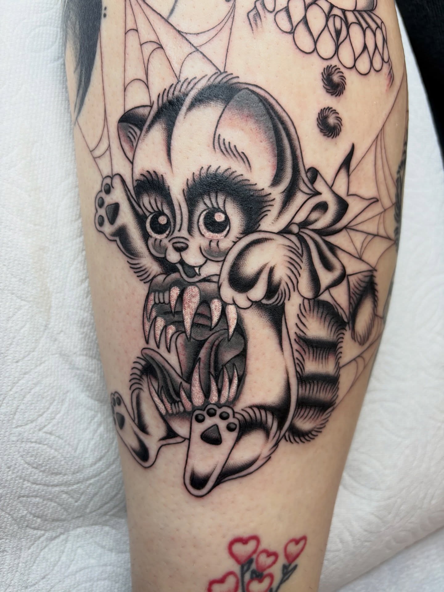 Cat American traditional tattoo on the forearm by Nori
