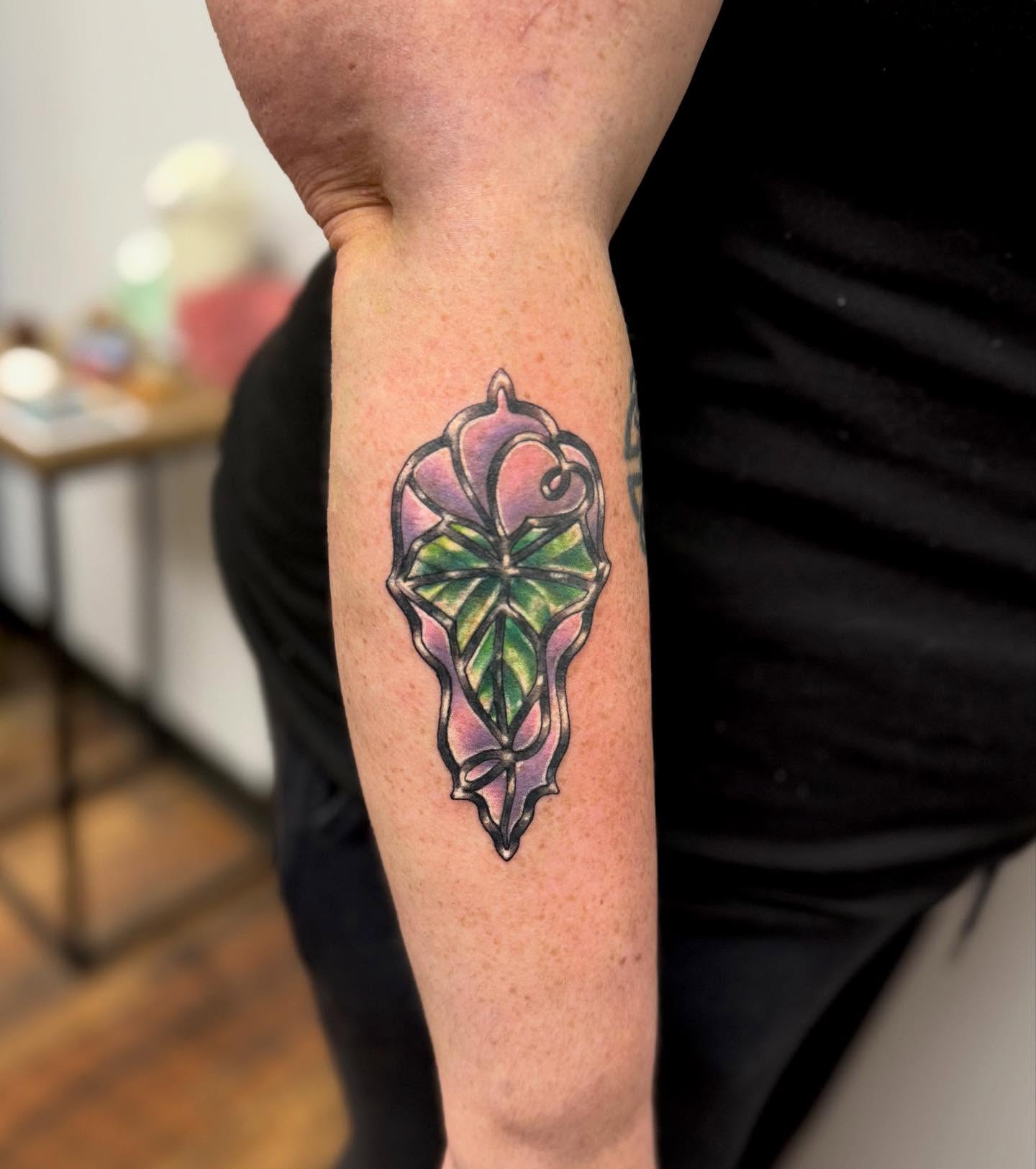 Stained glass window geometric tattoo on the forearm by KT