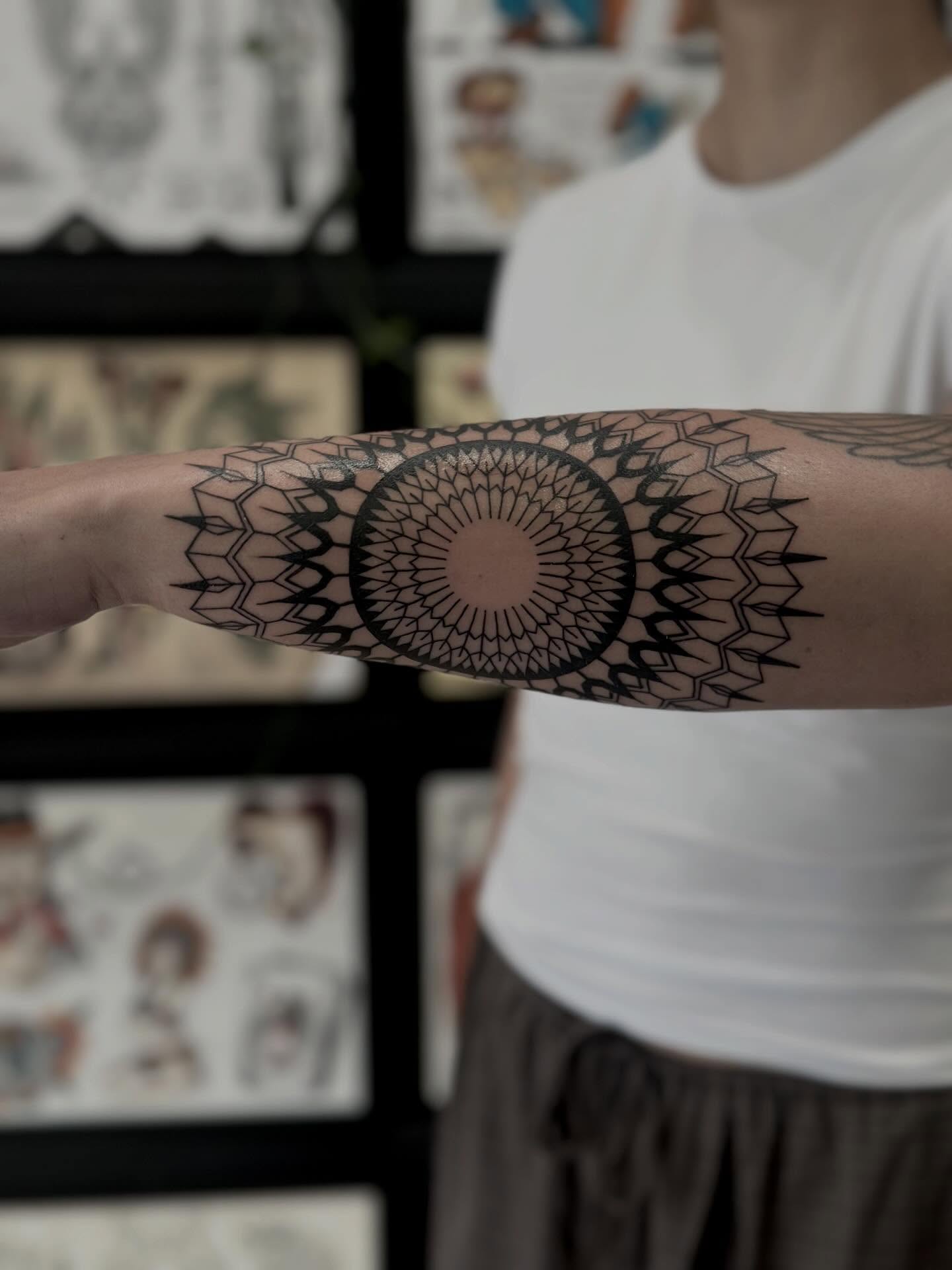 Mandala geometric tattoo on the forearm by Kat Fishbein